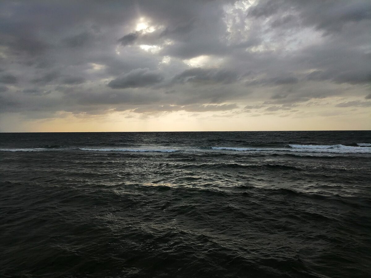 The Red Sea off the coast of Jeddah, Saudi Arabia, with waves under a dramatic sky