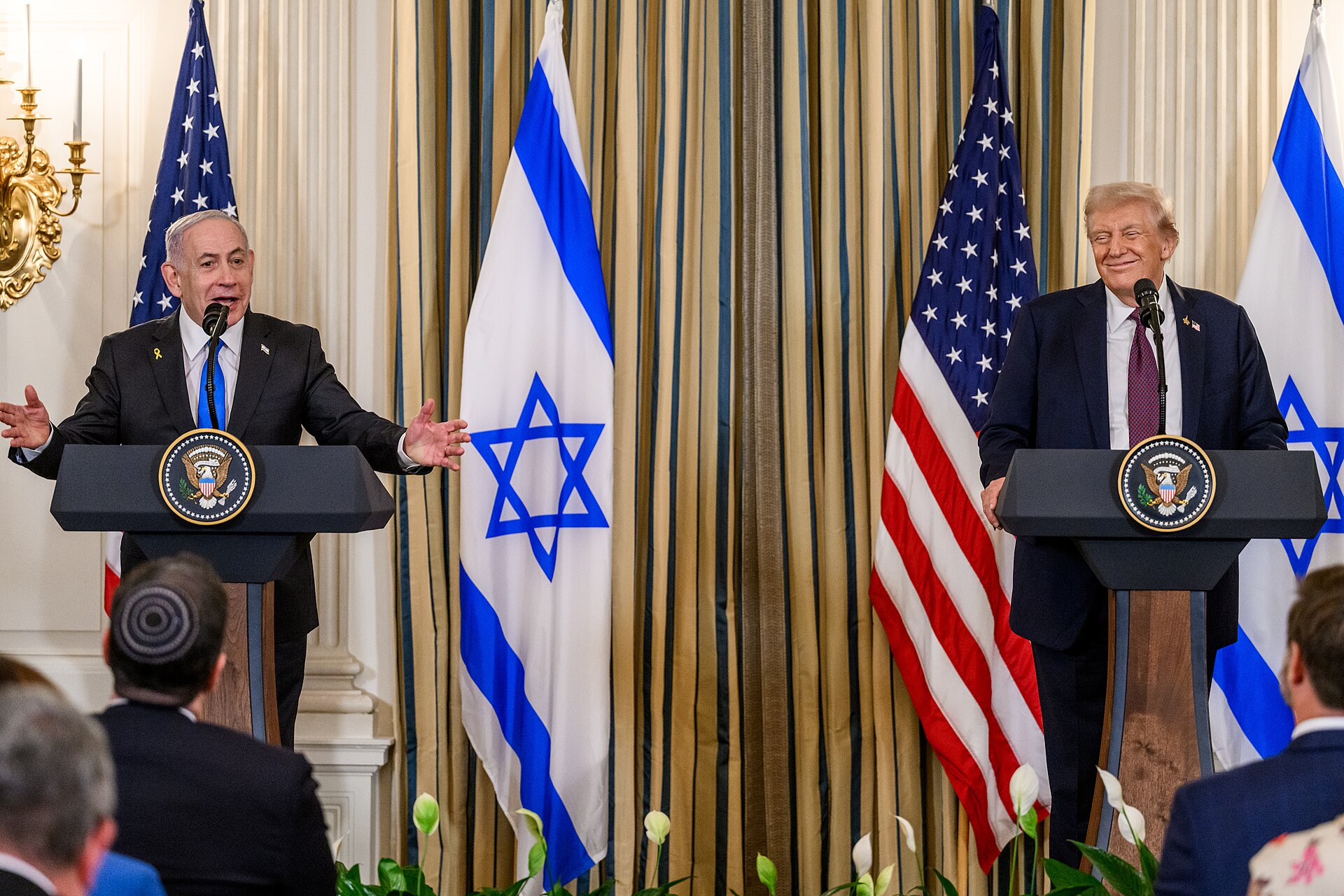 Netanyahu speaks at joint press conference with Trump at the White House, September 2025, with Israeli and US flags flanking the podiums
