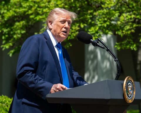President Trump speaking at White House podium with presidential seal, May 2025