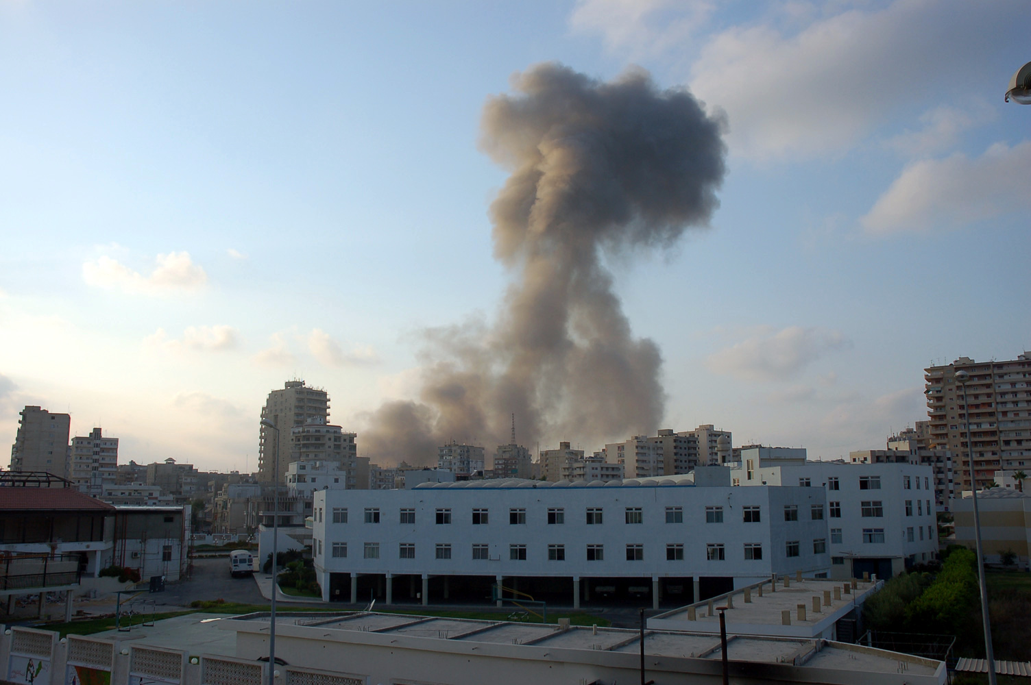 Smoke column rising over Tyre, Lebanon following an Israeli Air Force airstrike — the same self-defense clause authorising this strike reappears verbatim in the April 16 ceasefire text