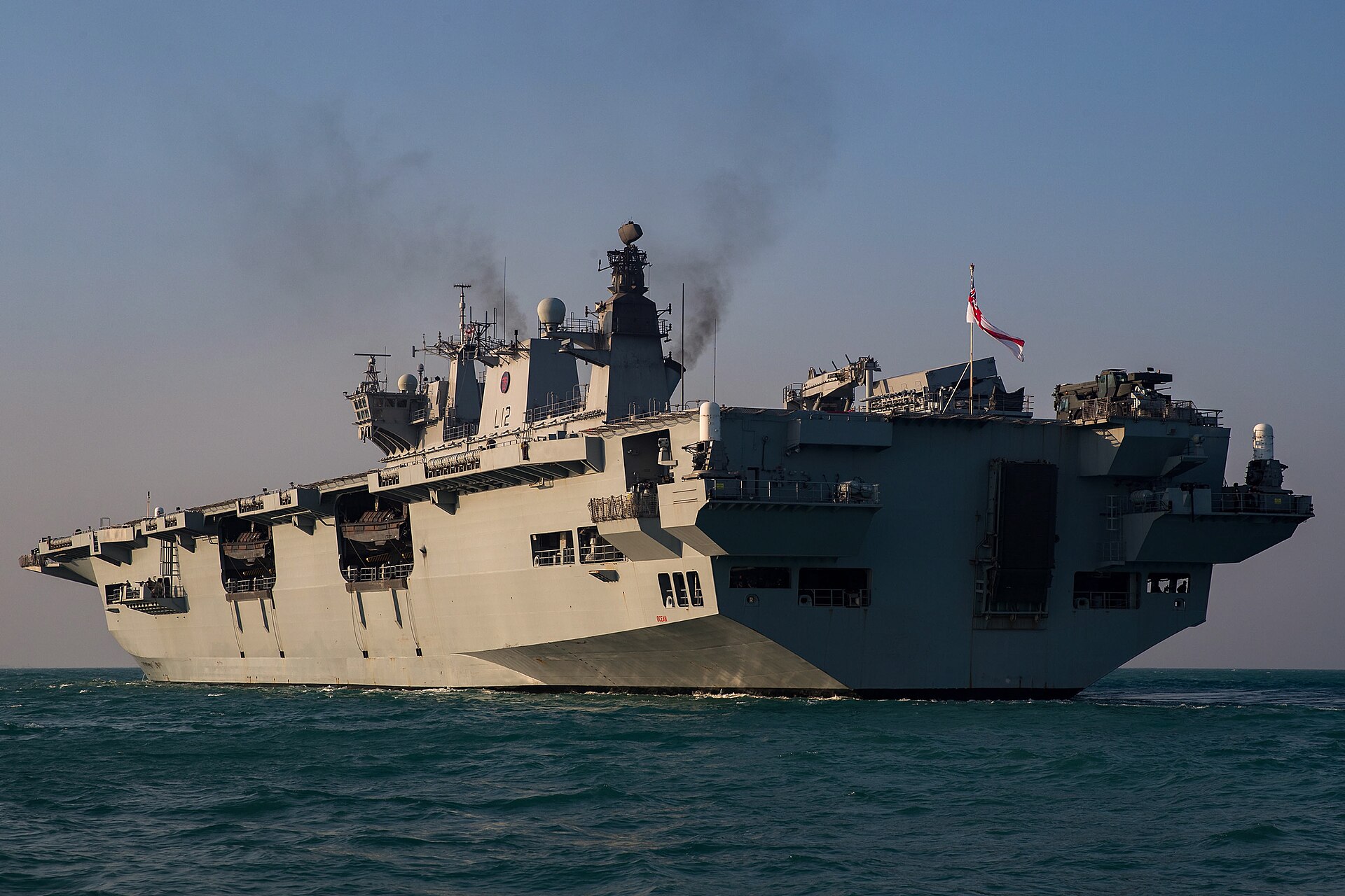 HMS Ocean amphibious assault ship flying Royal Navy White Ensign on deployment to the Gulf as part of the UK Joint Expeditionary Force Maritime task group