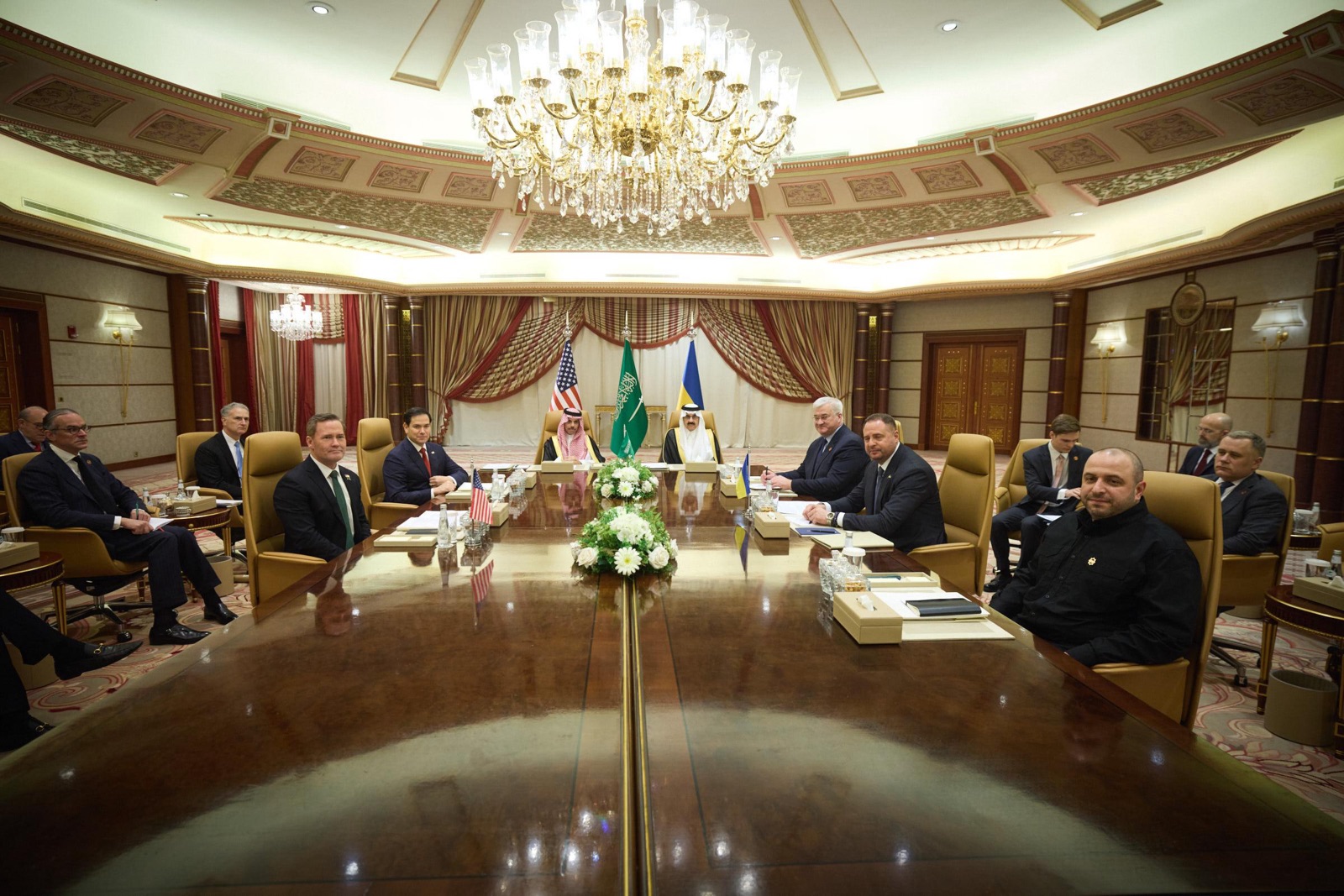 Ukraine and US delegations meeting in Jeddah, Saudi Arabia in 2025, with US, Saudi, and Ukrainian flags visible — the diplomatic context for the March 2026 Ukraine-Saudi defence cooperation agreement