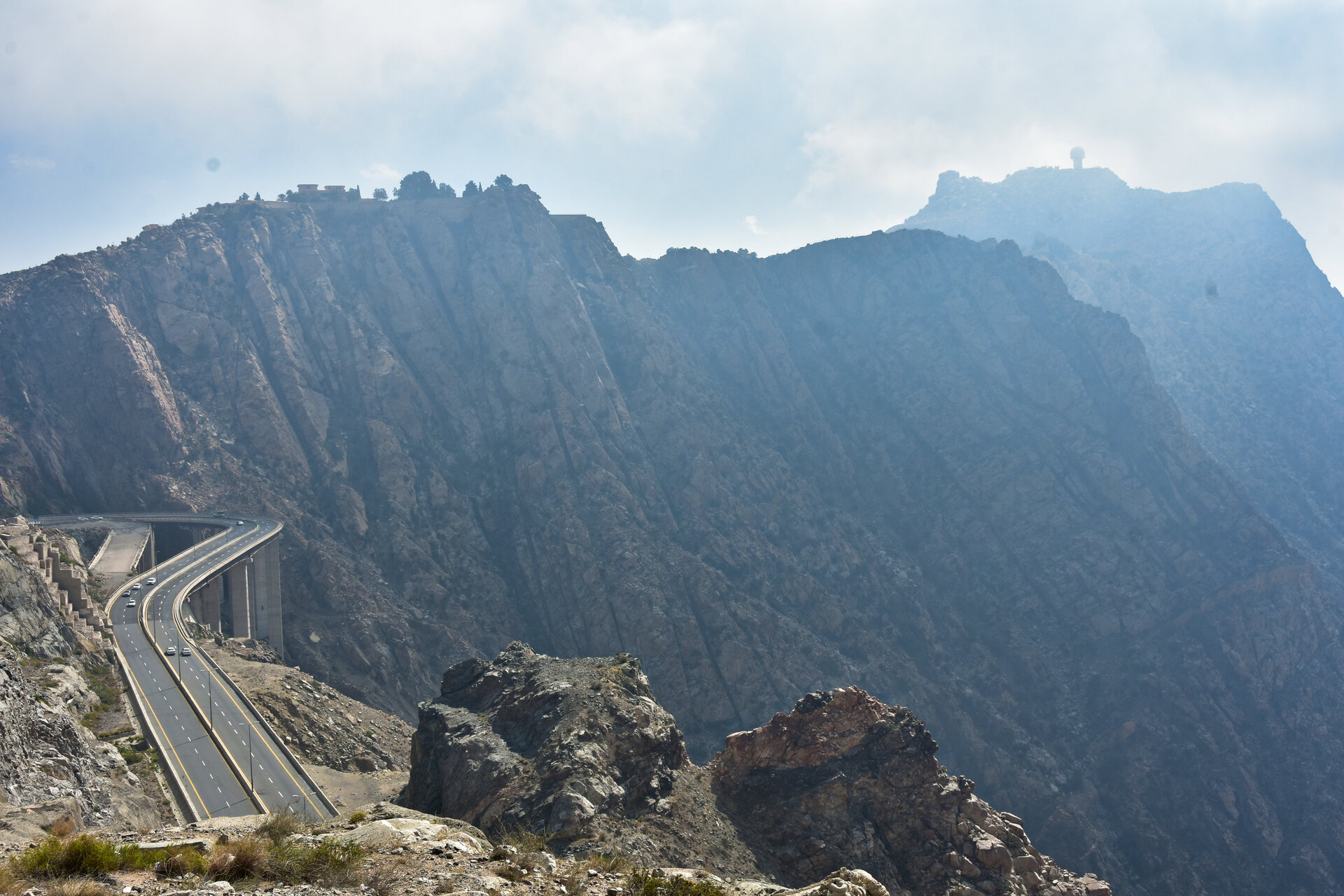 The Al-Hada mountain road near Taif, Saudi Arabia, with dramatic cliff faces and winding highway