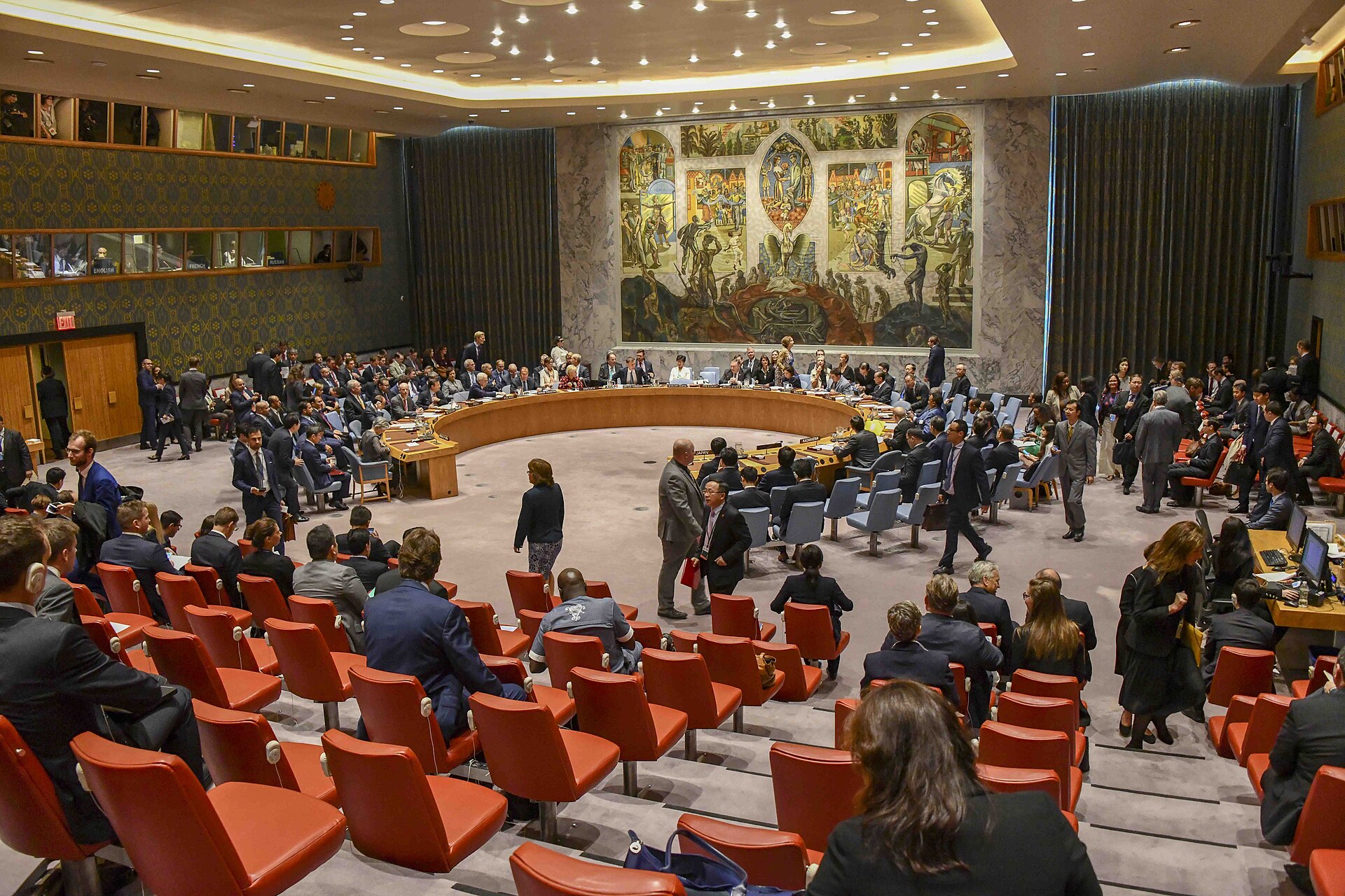United Nations Security Council chamber in session, showing the horseshoe table arrangement and member delegations