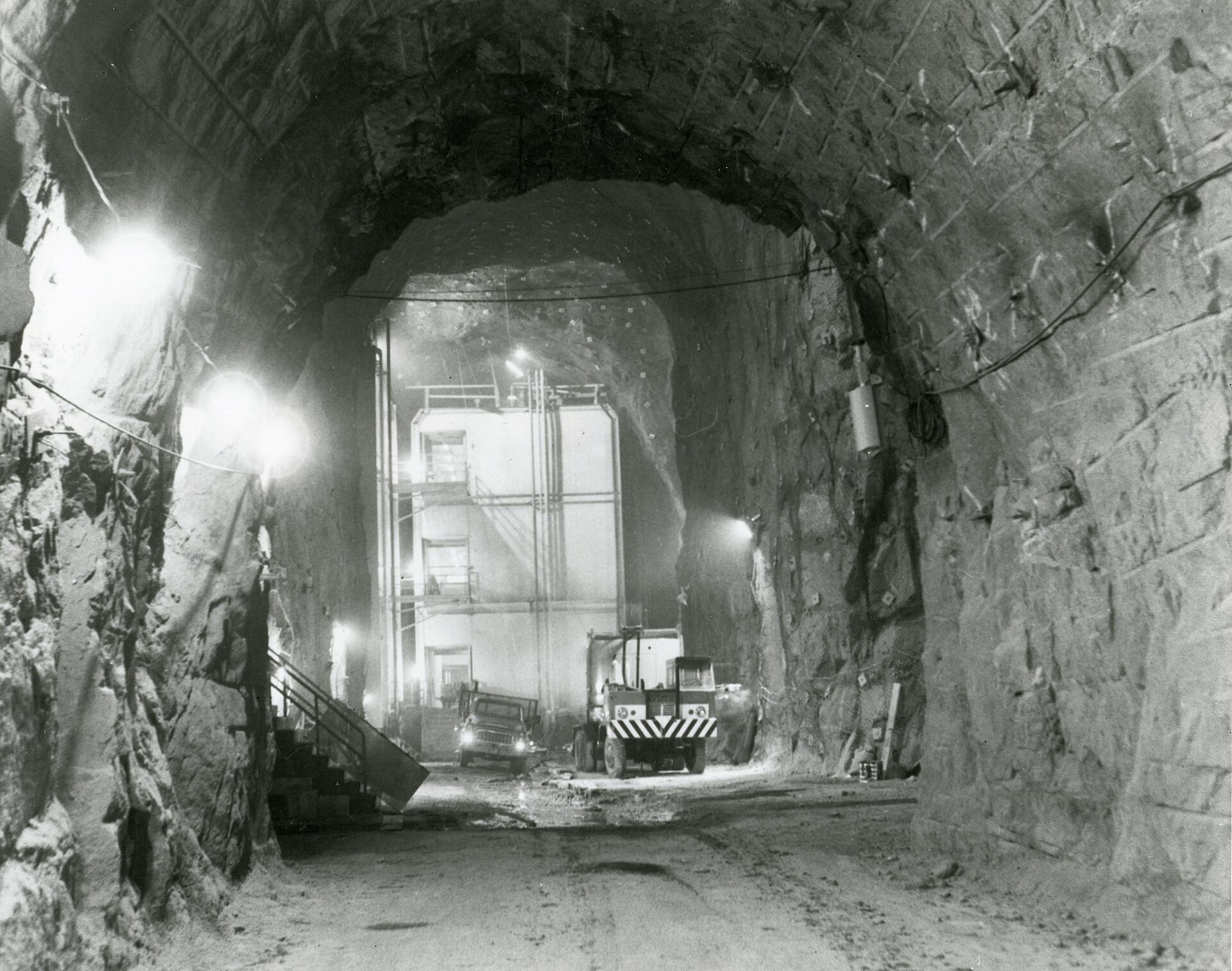 Underground military tunnel interior with construction equipment showing the scale of hardened underground military infrastructure