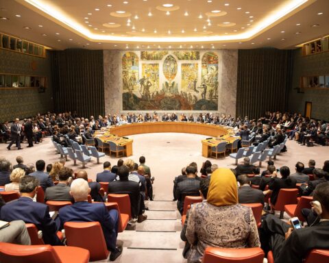 UN Security Council chamber during a high-level open debate, showing the horseshoe table with member state delegates, observer seating, and the Per Krohg mural — the same configuration used for the April 27, 2026 maritime security session on Hormuz