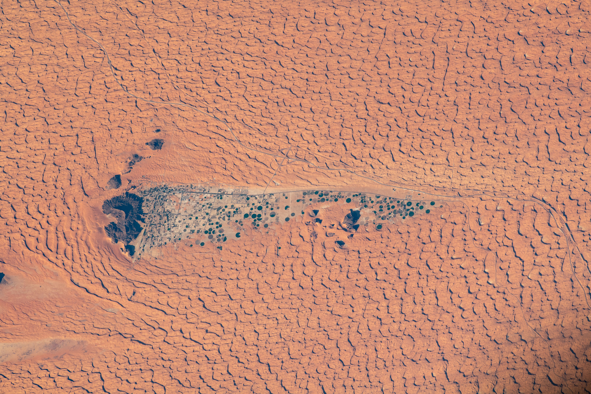 Aerial view of Jubbah oasis and the surrounding Nafud Desert, Hail Province, Saudi Arabia