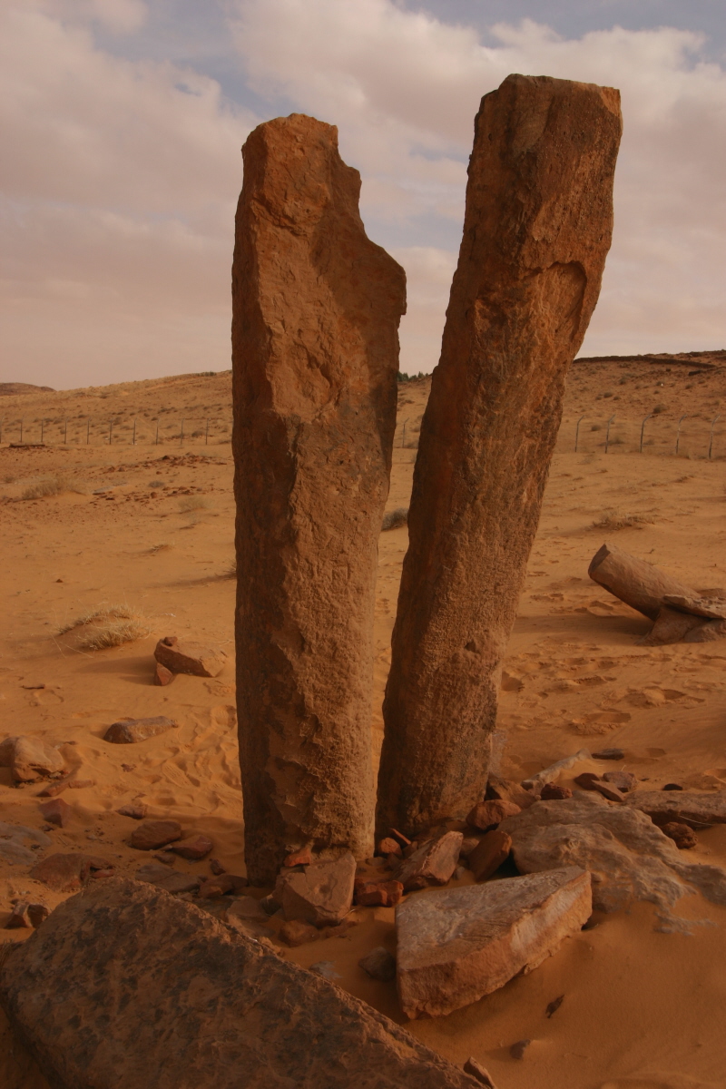 Al Rajajil standing stones near Sakaka, Saudi Arabia — sandstone pillars rising from the desert, dating to approximately 4000 BCE