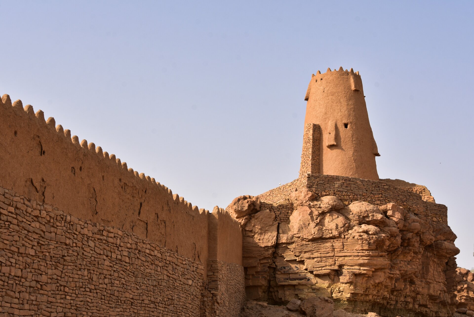 Marid Castle in Dumat al-Jandal, Al Jouf, Saudi Arabia — ancient stone fortress tower against a desert sky