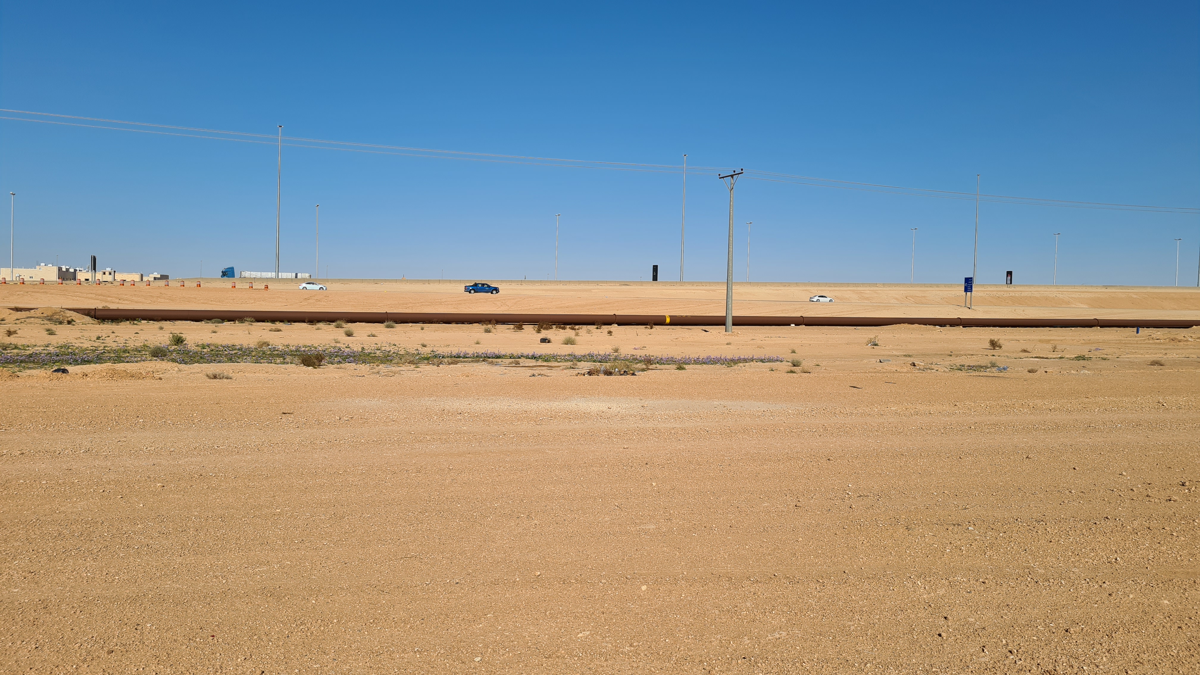 The Trans-Arabian Pipeline (Tapline) running through the flat desert landscape near Arar, Saudi Arabia