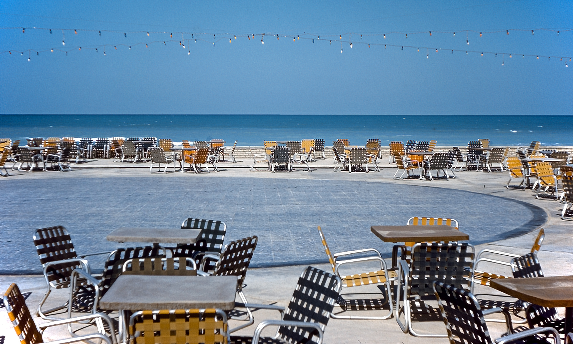 Beachfront patio with chairs and tables overlooking the Arabian Gulf, Half Moon Bay area, Eastern Province Saudi Arabia