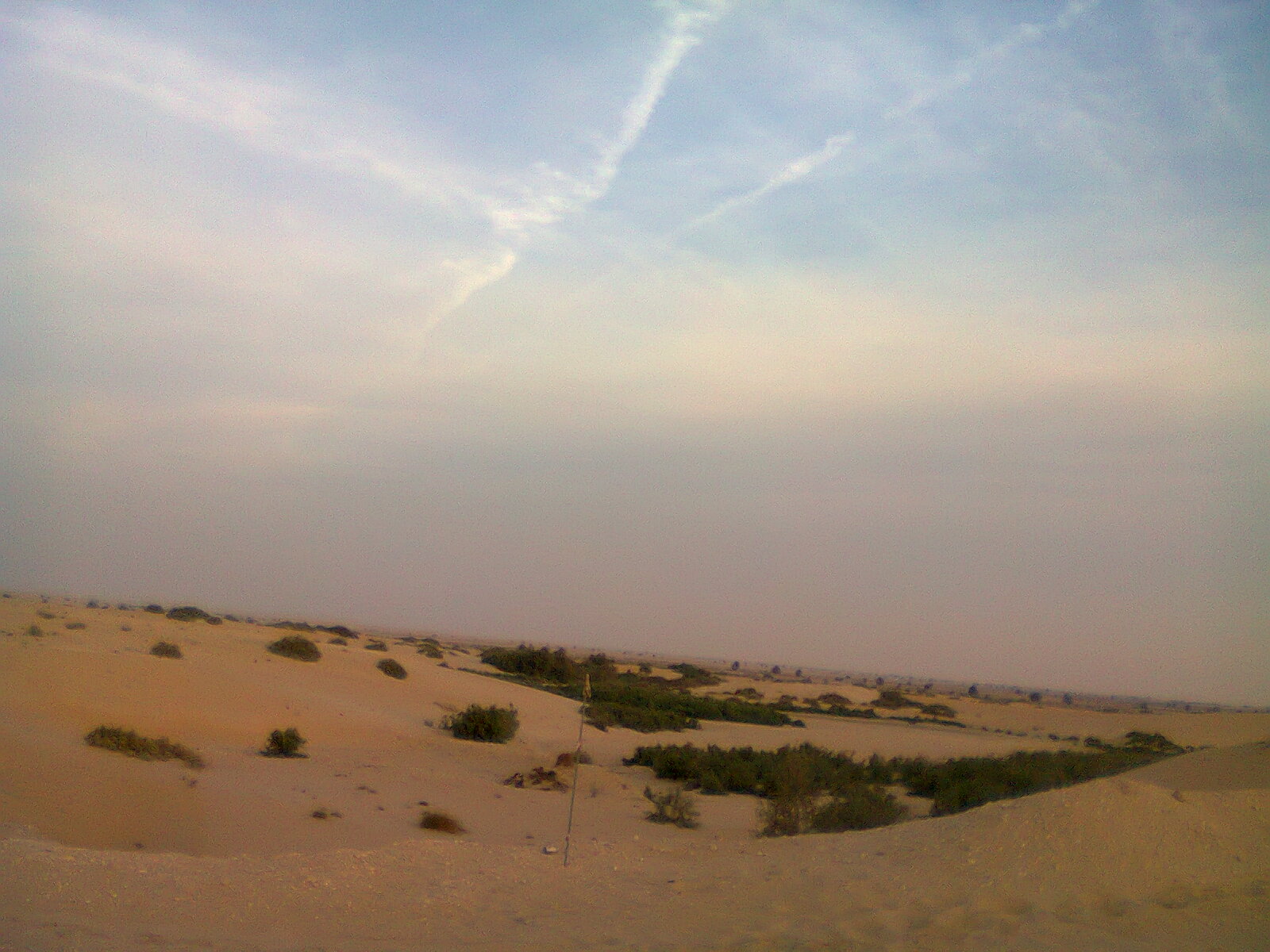Rolling red sand dunes in the Saudi Arabian desert