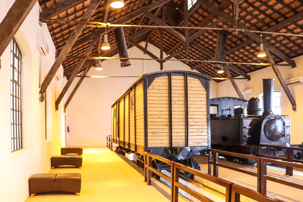 Restored Hejaz Railway locomotive and freight car inside the Tabuk station museum