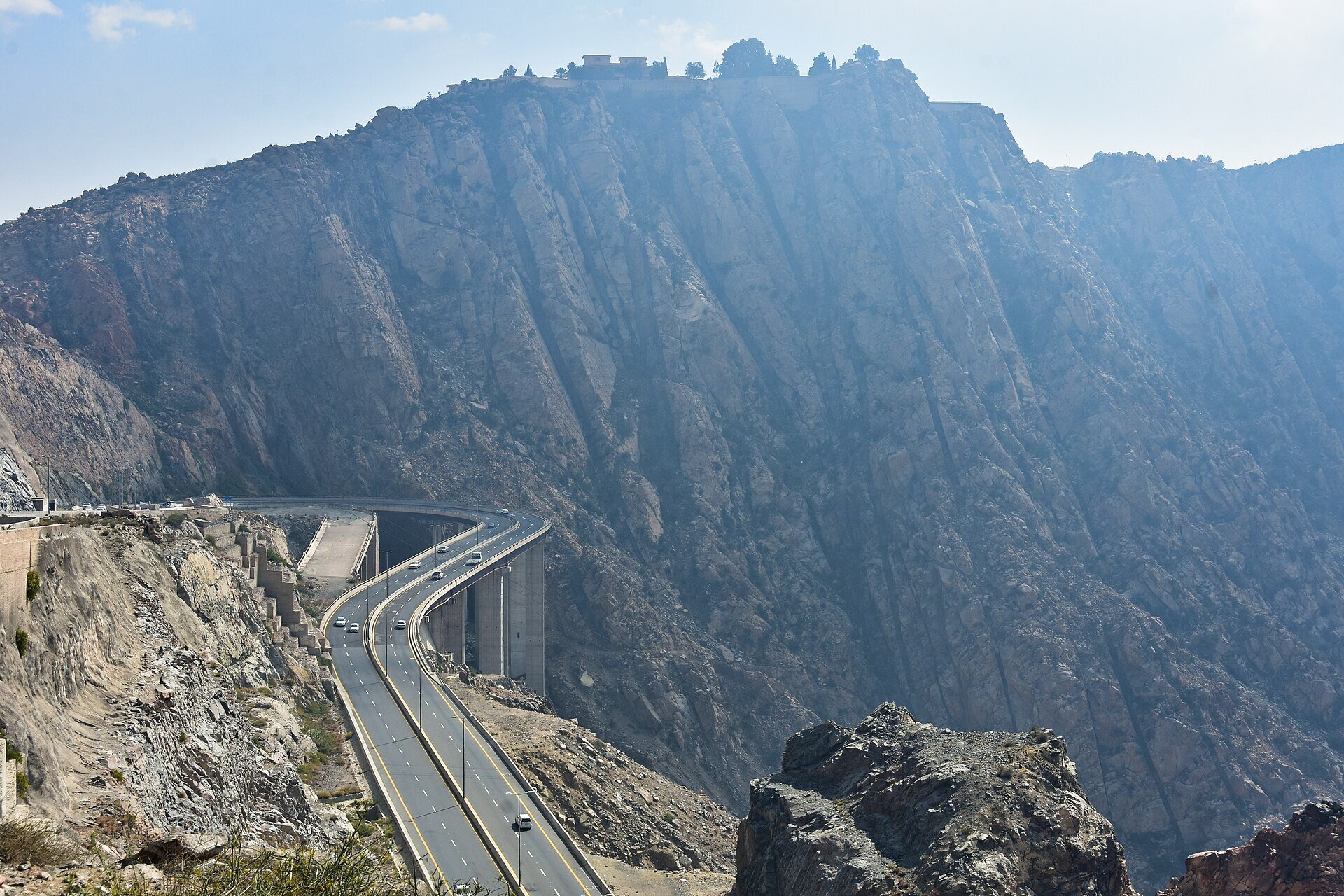 Panoramic view of Al Hada mountain road with hairpin bends descending through the Sarawat escarpment near Taif, Saudi Arabia