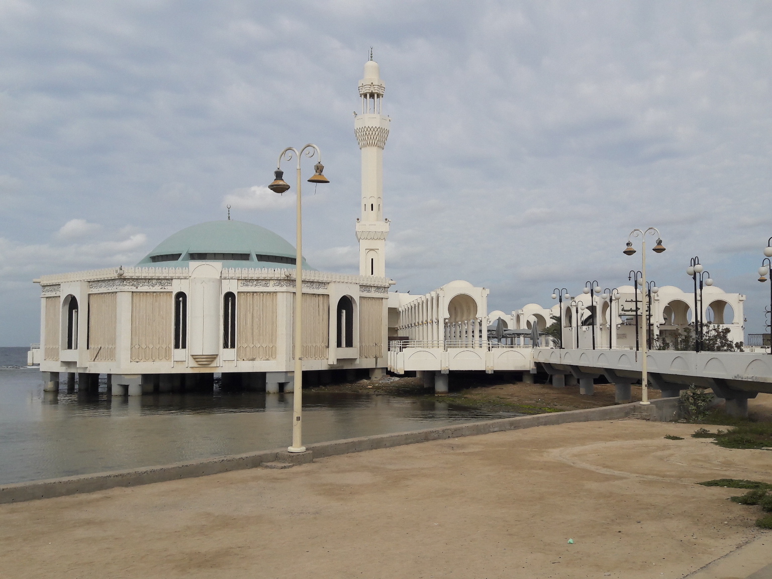 Al Rahmah Floating Mosque in Jeddah built on stilts over the Red Sea with white dome and minaret
