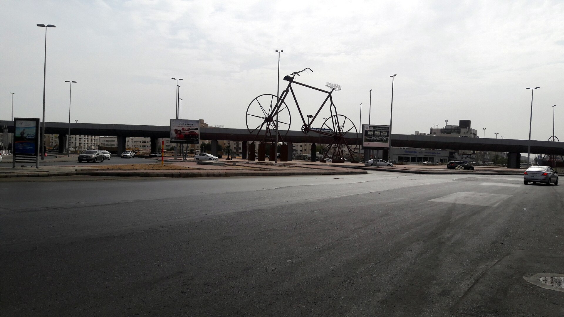 Giant bicycle sculpture at a Jeddah roundabout, part of the city's open-air public art collection
