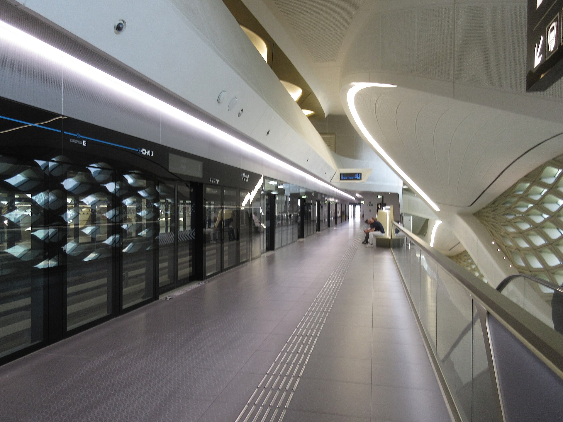 Platform of Riyadh Metro Blue Line at KAFD station showing platform screen doors and modern architecture