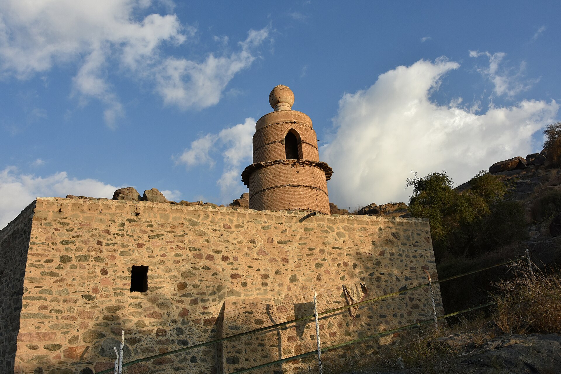 Historic mosque in Taif, Saudi Arabia, with traditional Islamic architecture against a mountain backdrop