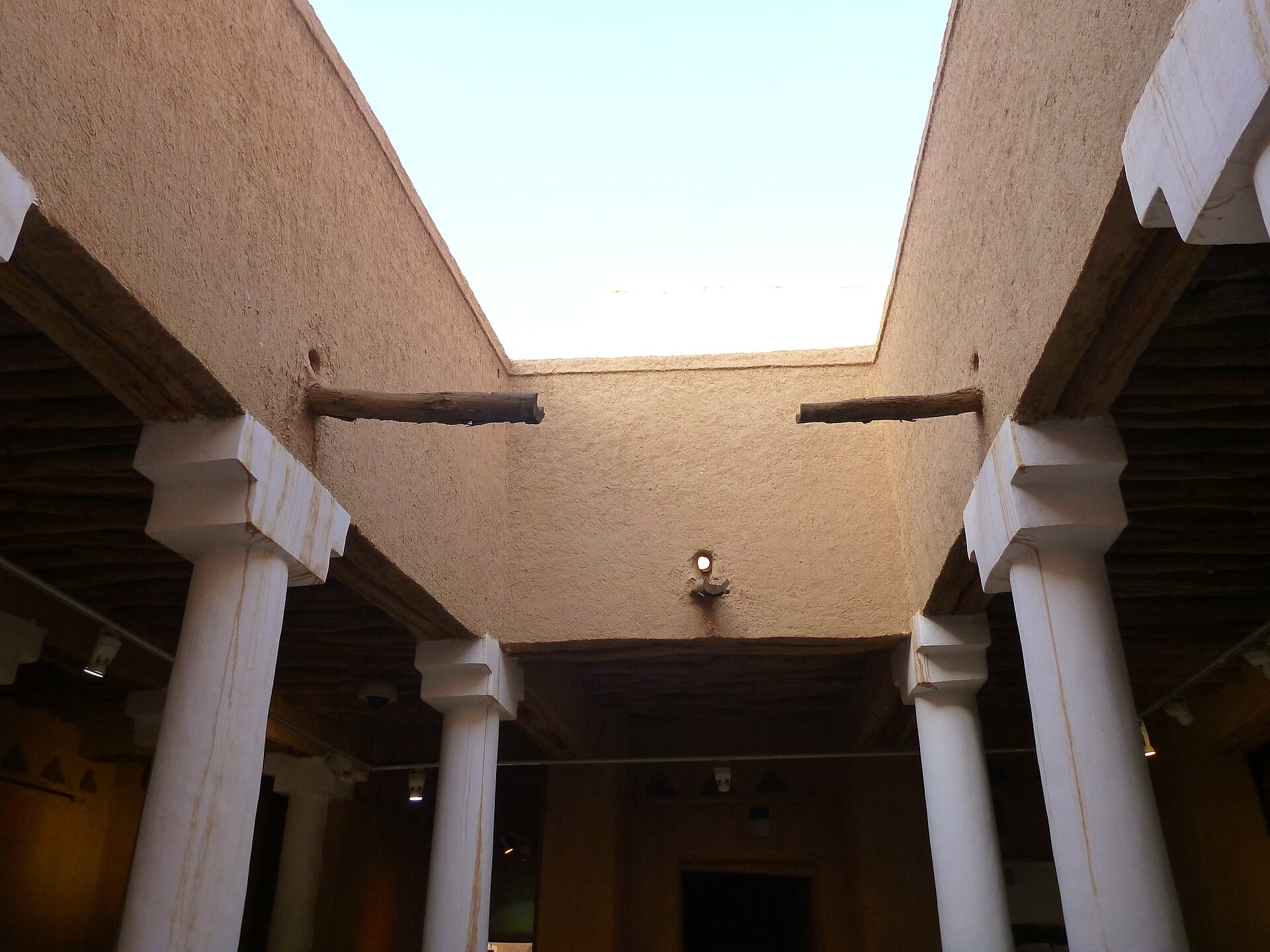 Interior courtyard of Al Masmak Citadel, Riyadh — mud-brick walls and traditional wooden roof beams visible