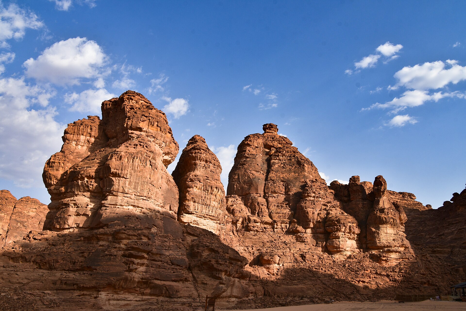 Dramatic sandstone rock formations rising above the desert near Shaden Resort in AlUla, Saudi Arabia