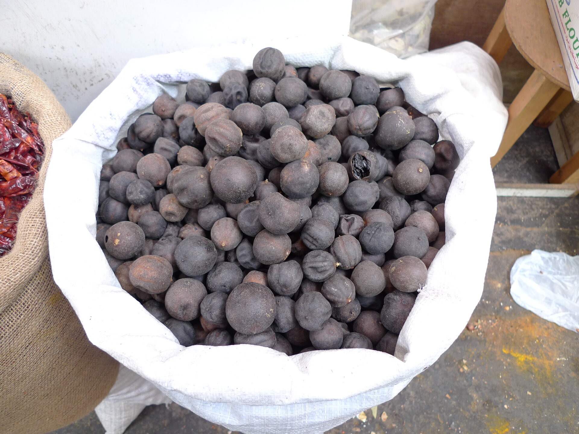 Sacks of dried black limes, known as loomi or Persian limes, at a Gulf market