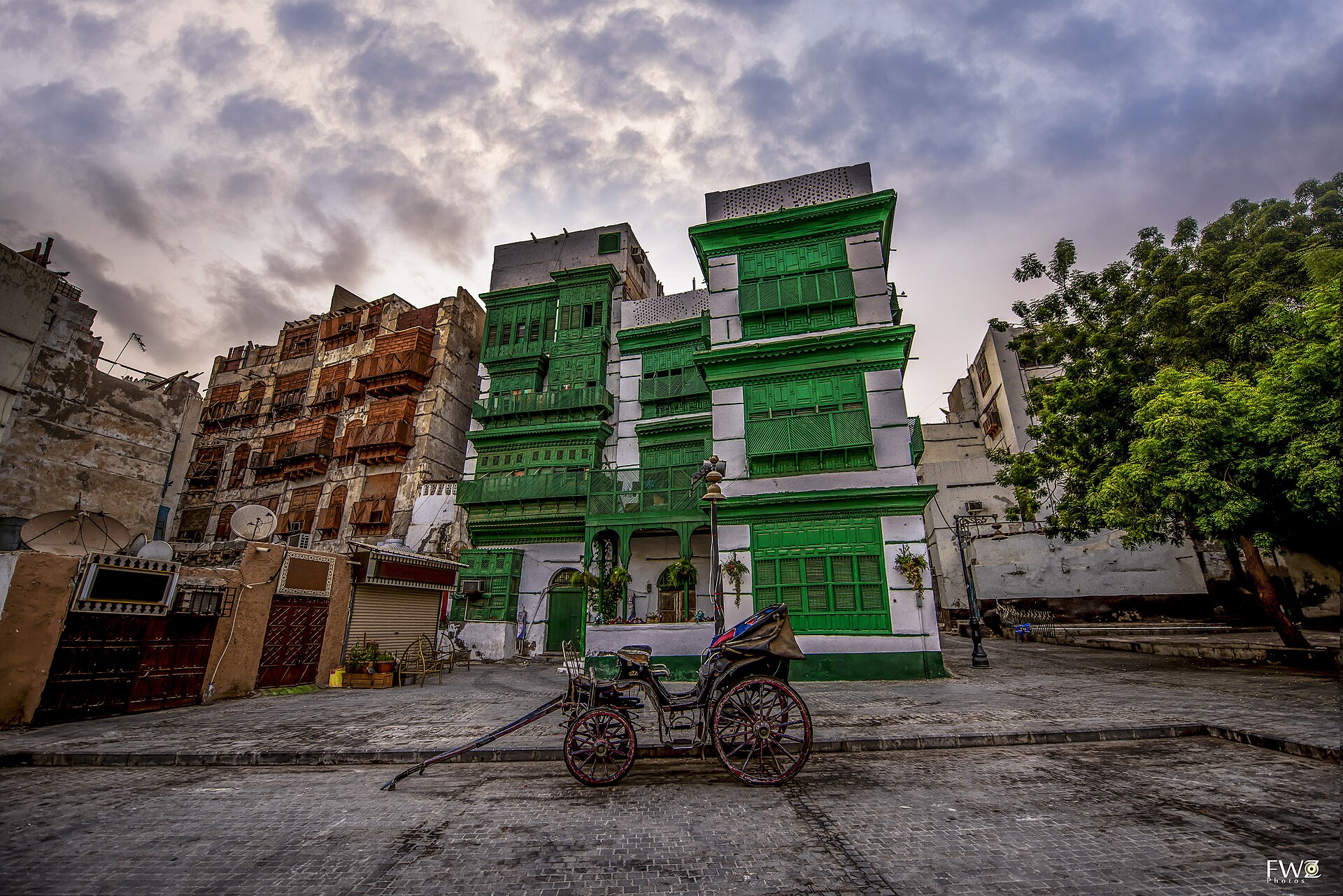 Historic green coral-stone buildings in Al Balad, the UNESCO-listed old quarter of Jeddah
