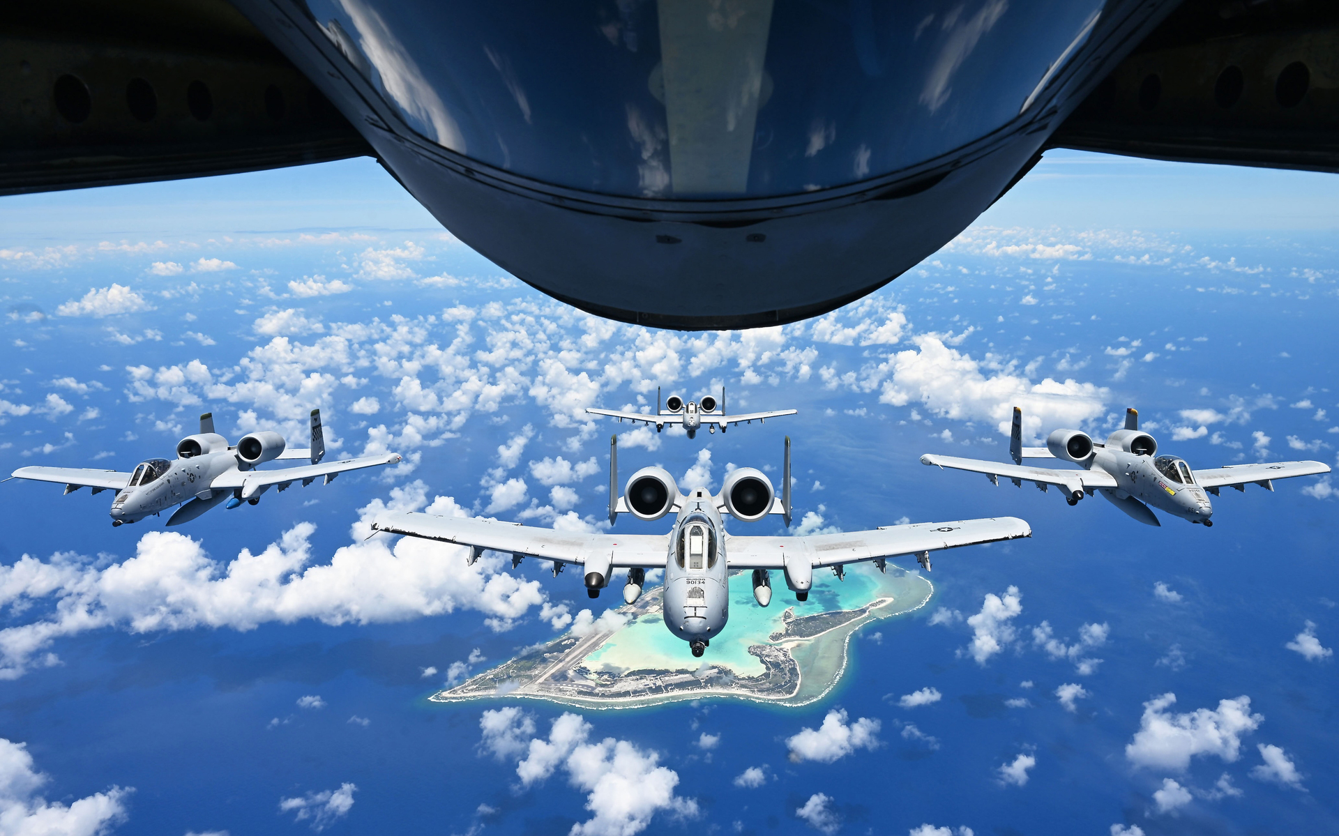 A-10C Thunderbolt II Warthogs in formation over Wake Island, June 2025 — the same type deployed by the 75th Expeditionary Fighter Squadron over the Strait of Hormuz in Operation Epic Fury
