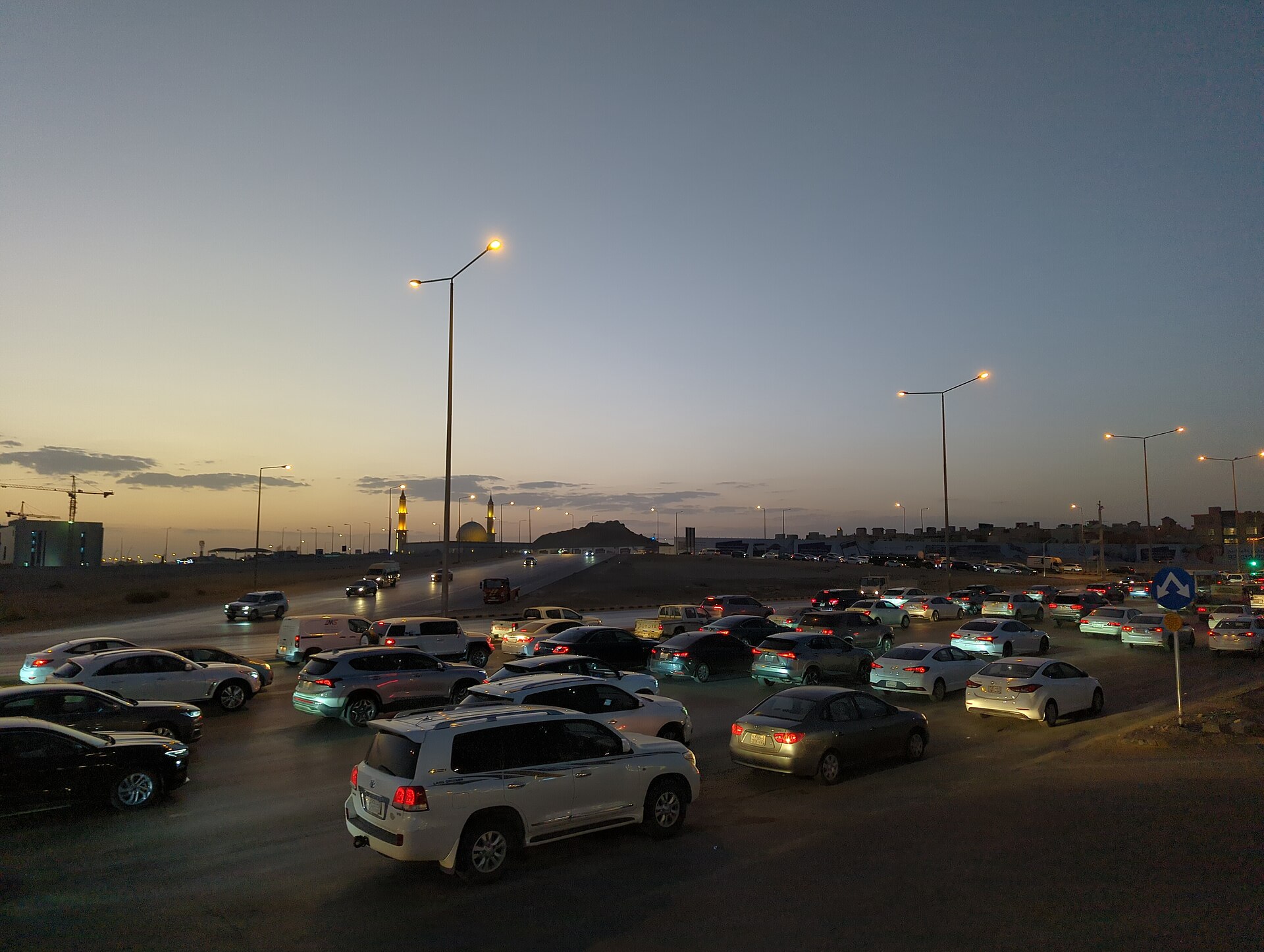 Heavy traffic on a Riyadh highway during evening rush hour, demonstrating the driving conditions visitors should expect