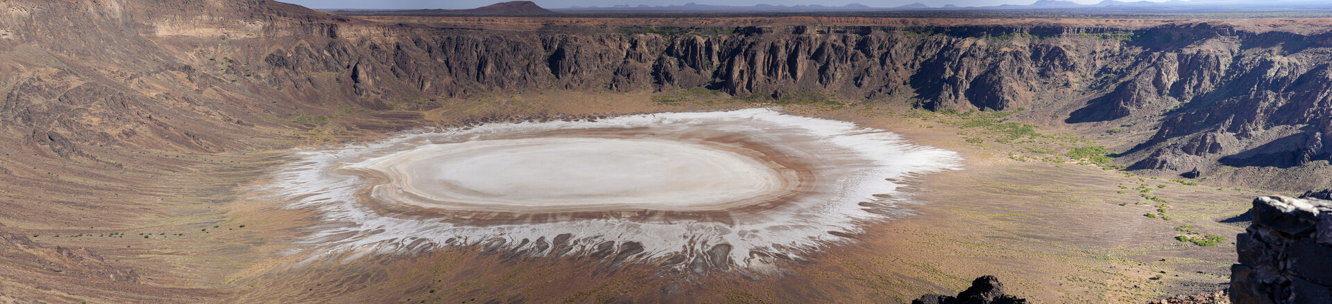 High-resolution panorama of Al Wahbah Crater showing the white gypsum floor and dark volcanic walls in detail
