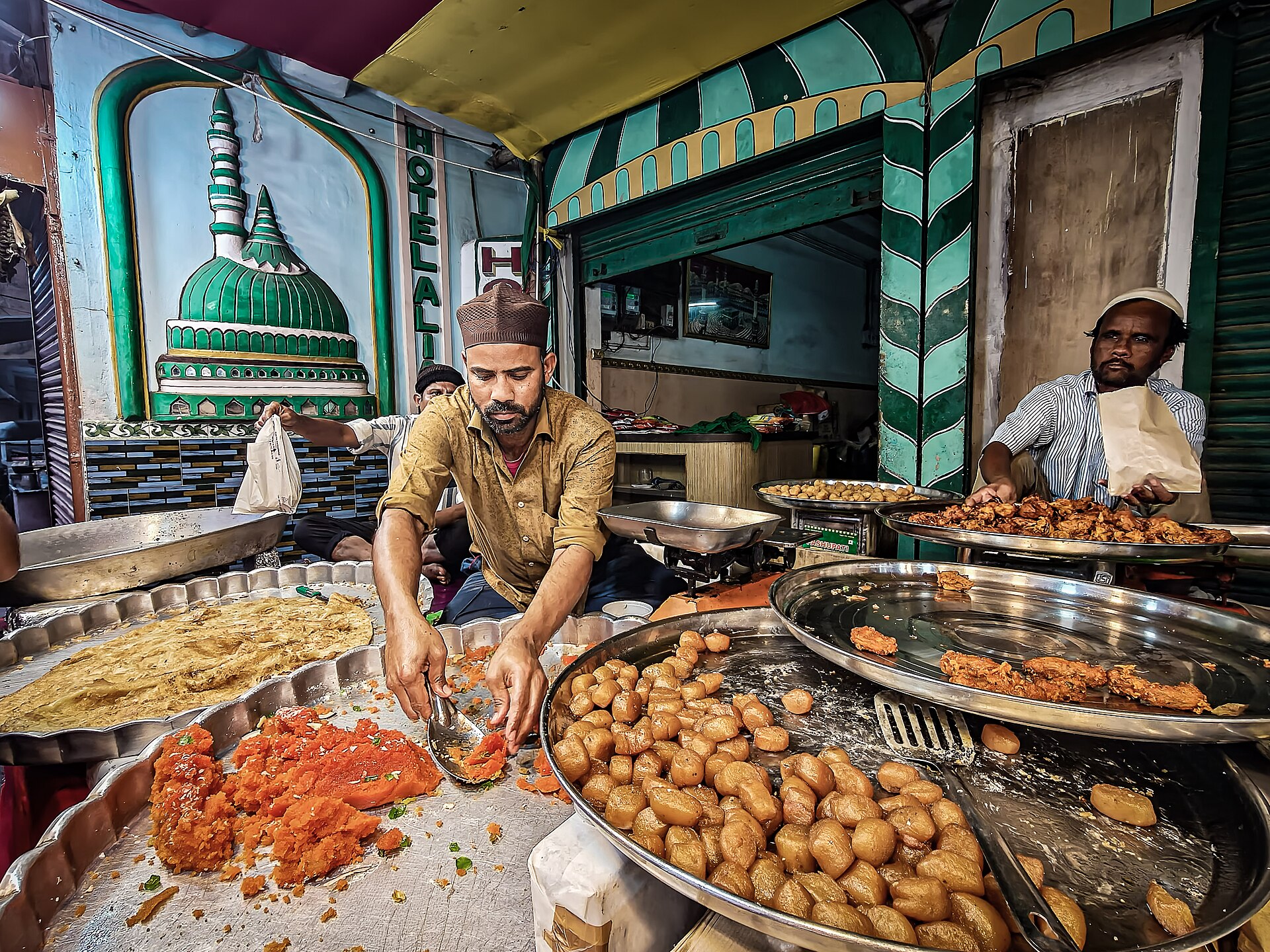Traditional iftar food spread during Ramadan with sweets and fried delicacies