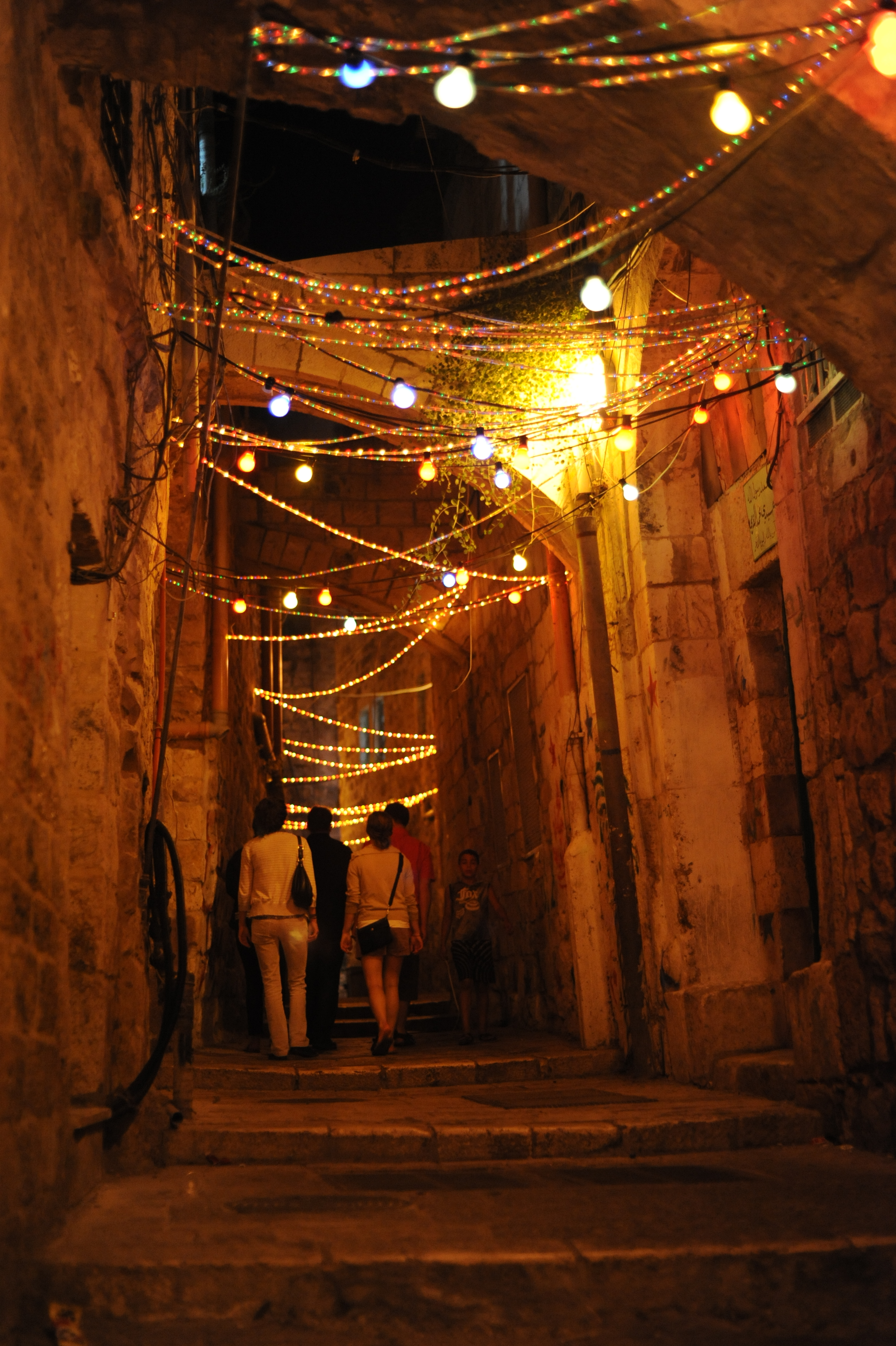 Historic old town street illuminated with Ramadan decorations and lanterns at night