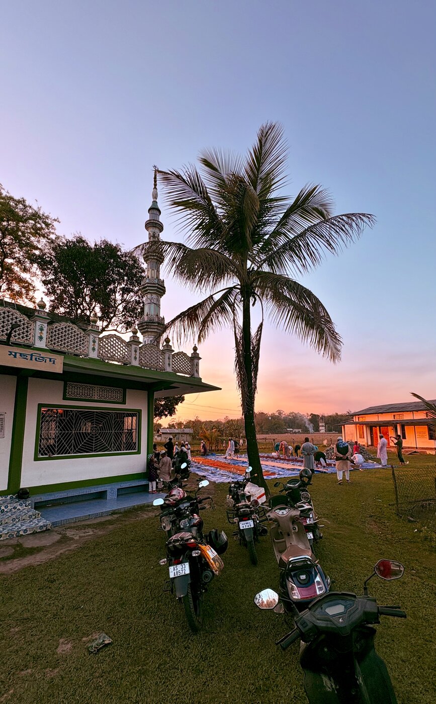 Muslims gathering at a mosque at sunset for iftar — the meal breaking the Ramadan fast