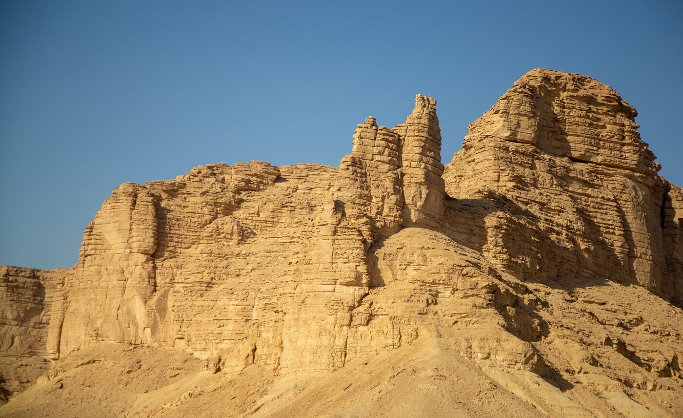 Rock formations and layered limestone at the base of the Tuwaiq Escarpment near Riyadh