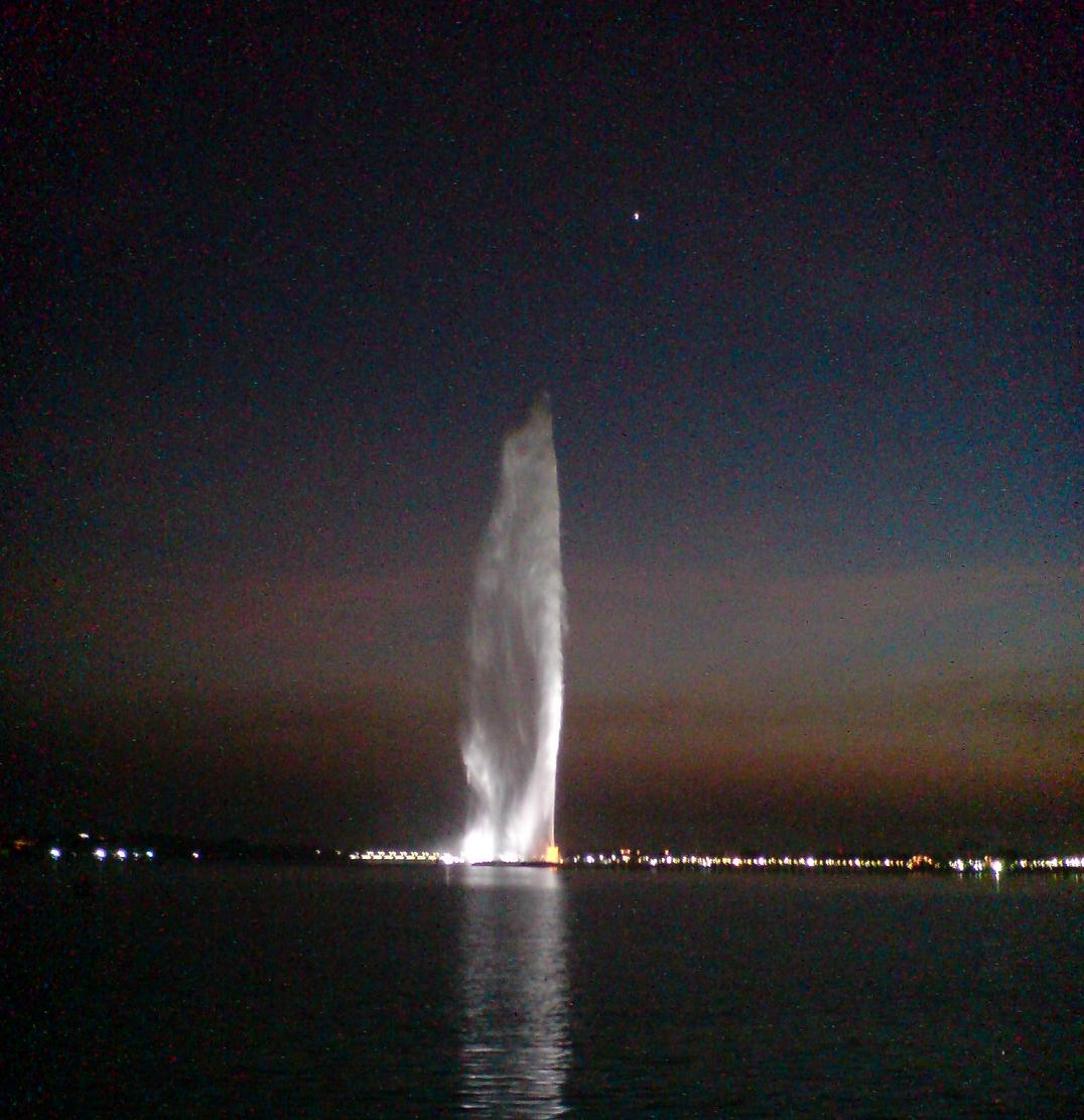 King Fahd's Fountain shooting a column of white water high into the night sky over the Red Sea in Jeddah