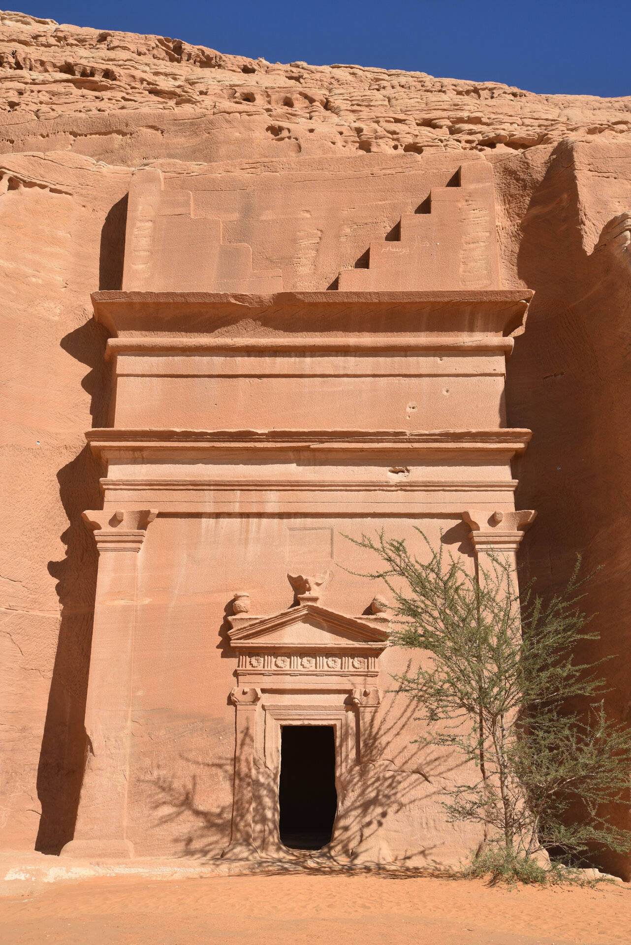 Decorated Nabataean tomb facade at the Qasr al-Bint necropolis, Hegra, Saudi Arabia