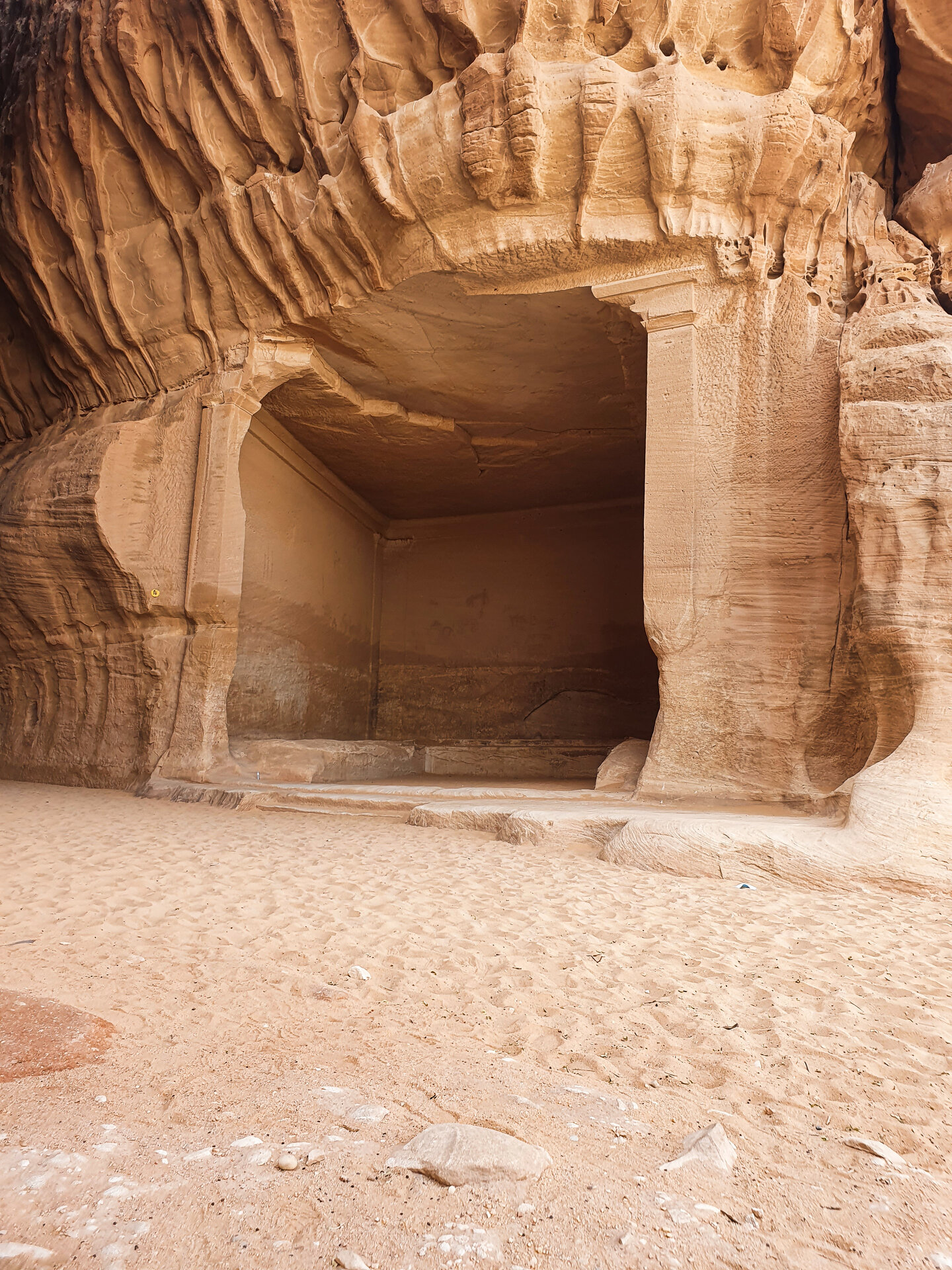 The Diwan carved chamber at Jabal Ithlib, Hegra, showing the entrance to the ancient Nabataean triclinium