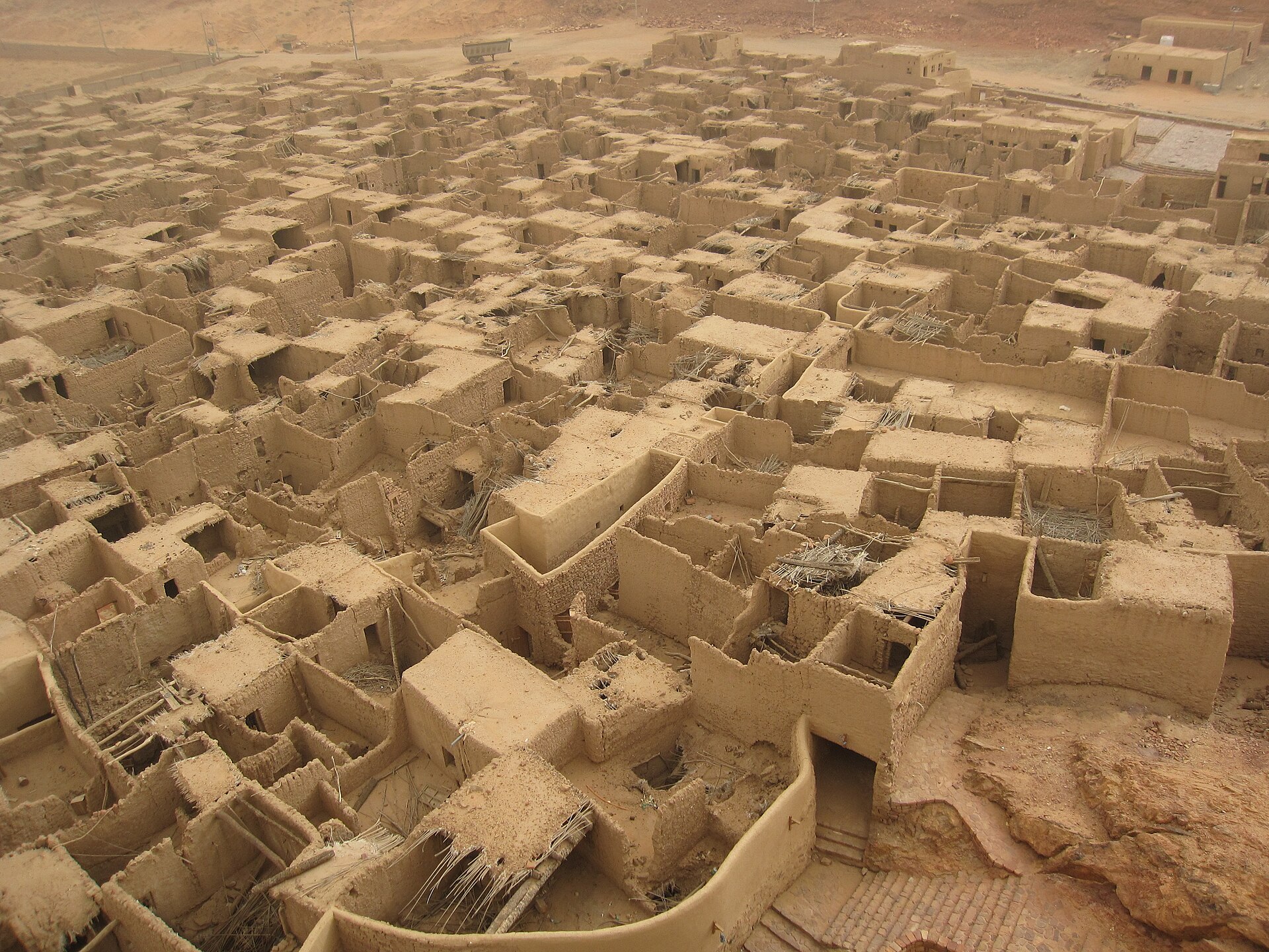 Aerial view of AlUla Old Town, showing densely packed mud-brick buildings in the traditional settlement