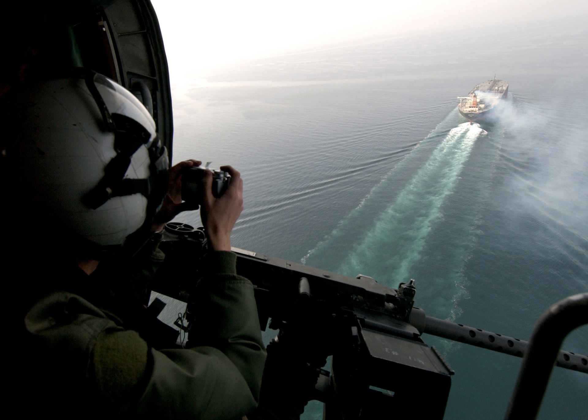 US Navy helicopter monitors oil tanker transiting the Persian Gulf, February 2005 — the type of aerial surveillance CENTCOM deployed during the April 18 Hormuz incidents