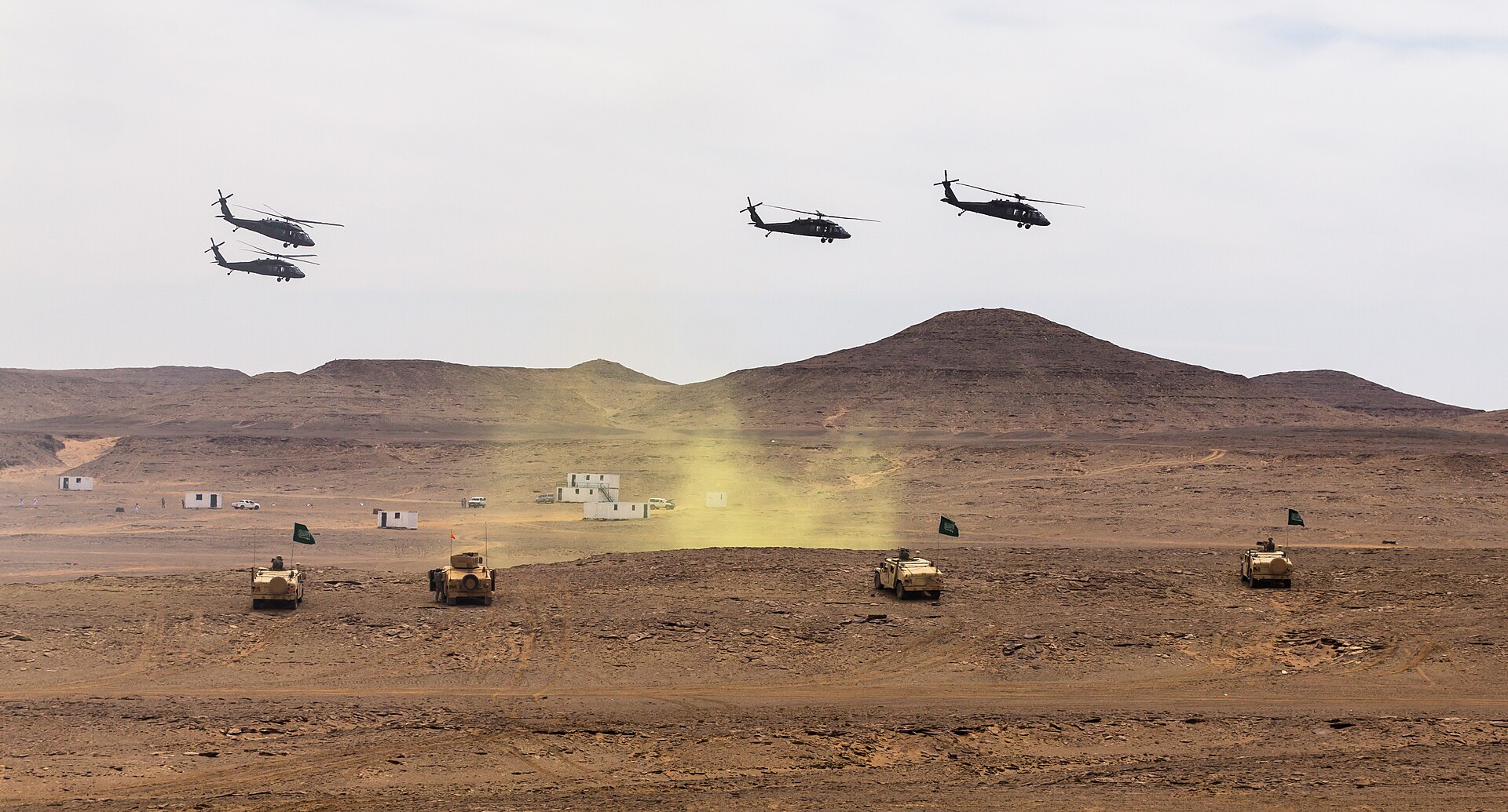 UH-60 Black Hawk helicopters and Saudi Royal Land Forces armored vehicles during Iron Hawk 14 joint exercise in Saudi Arabia — the kind of bilateral US-Saudi military coordination the GCC Peninsula Shield Force has never replicated at bloc level