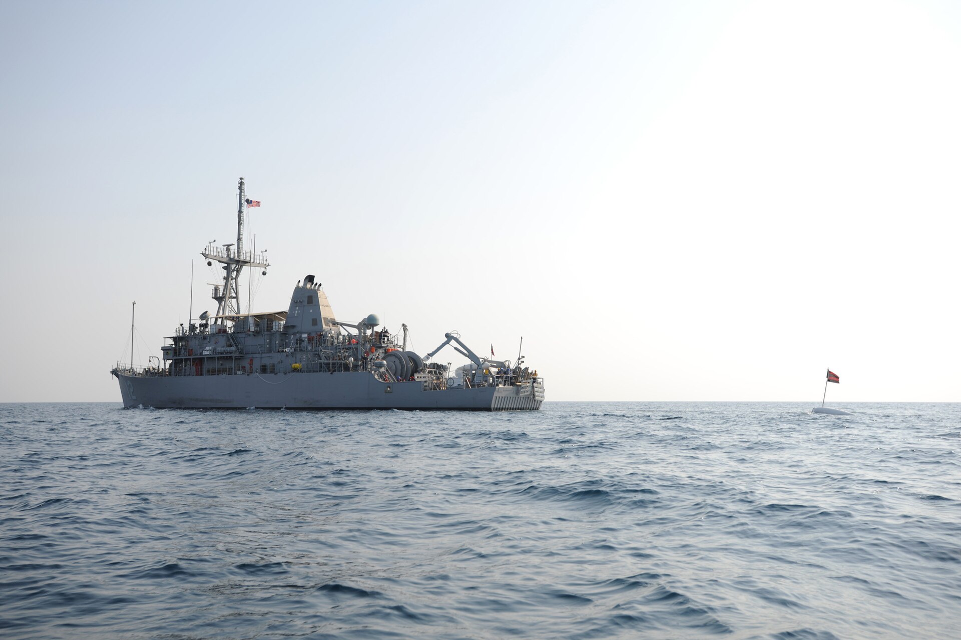 USS Ardent (MCM-12), Avenger-class mine countermeasures ship, conducts minesweeping training with EOD divers in the Arabian Gulf, 2010