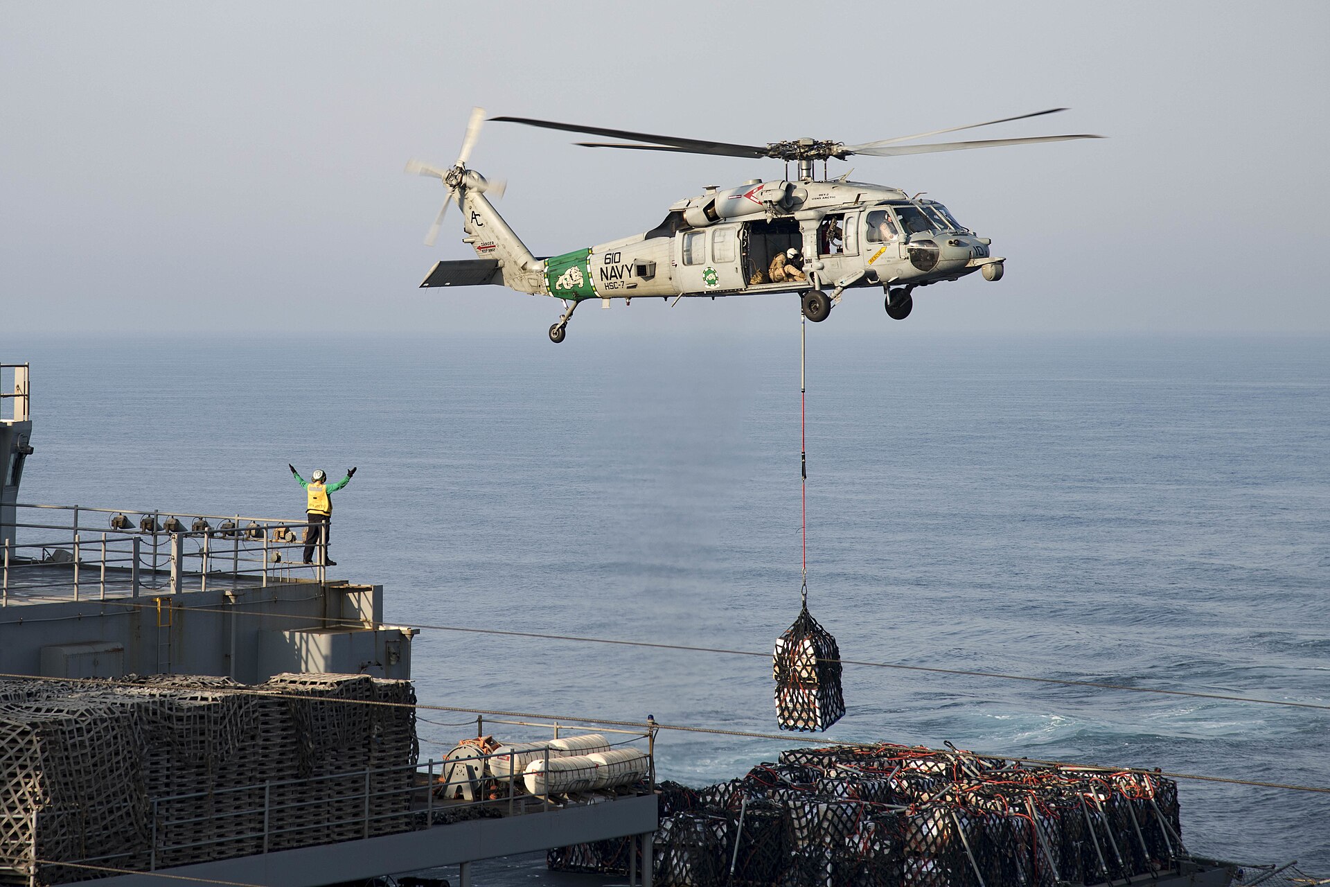 MH-60S Seahawk helicopter conducts resupply operations aboard USS Dwight D. Eisenhower in the Arabian Gulf, August 2016