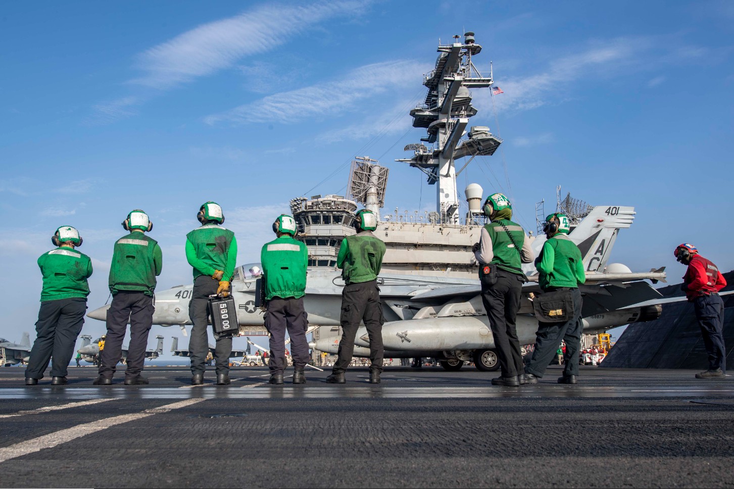 USS Dwight D. Eisenhower aircraft carrier flight deck operations in the Red Sea, March 2024, with F/A-18 Super Hornet and crew