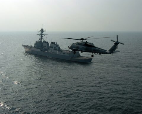 USS Mason DDG-87 guided-missile destroyer and SH-60B Seahawk helicopter patrol the Northern Persian Gulf, US Fifth Fleet