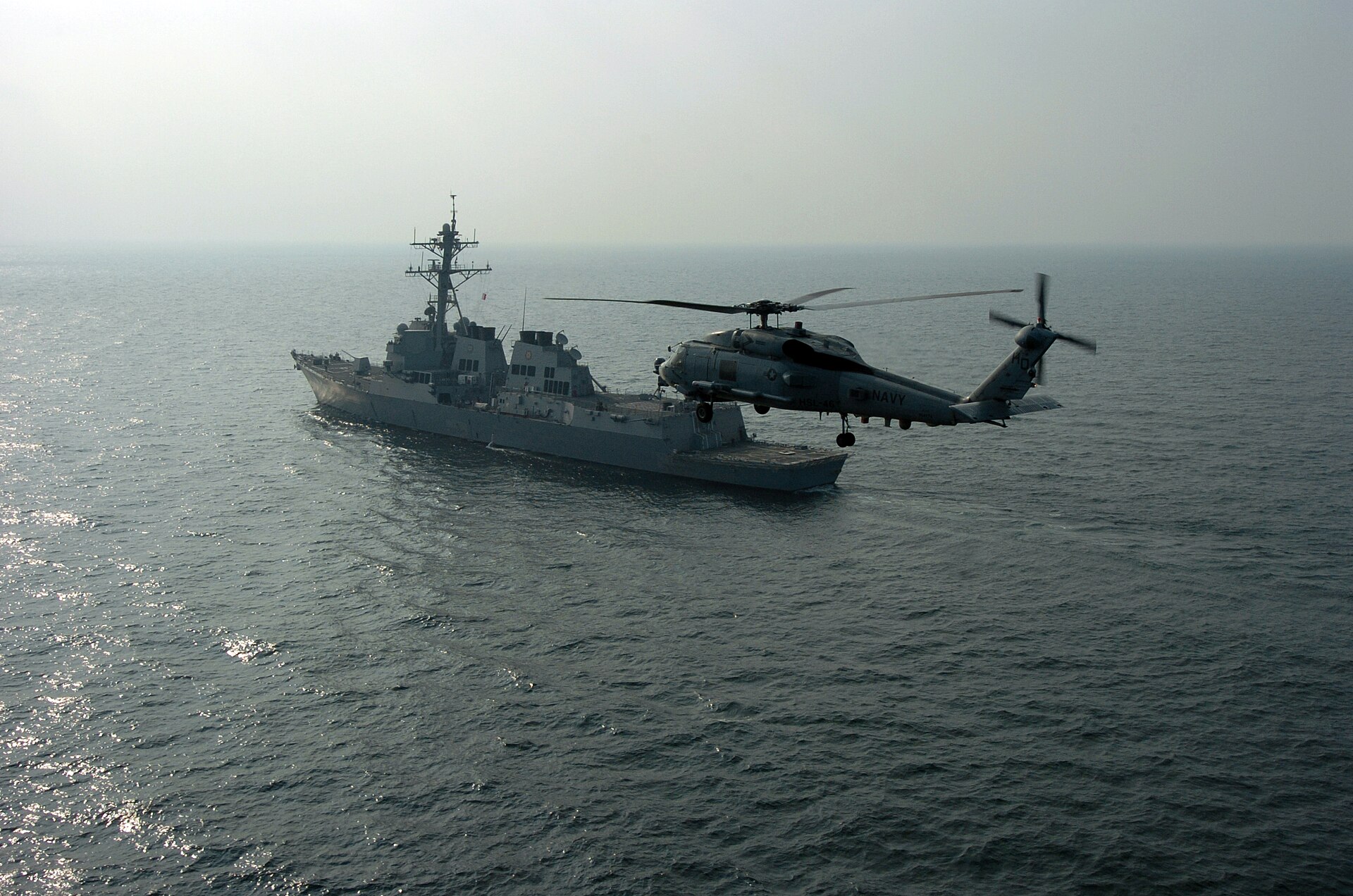 USS Mason DDG-87 guided-missile destroyer and SH-60B Seahawk helicopter patrol the Northern Persian Gulf, US Fifth Fleet