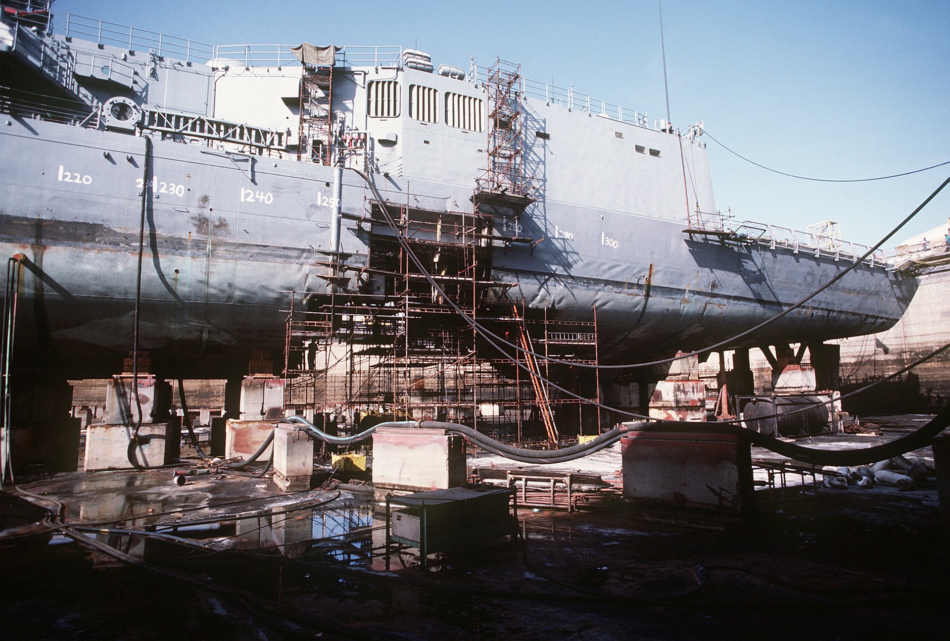 USS Samuel B Roberts FFG-58 in drydock undergoing repair after Iranian contact mine strike on April 14 1988, showing keel damage from the Persian Gulf incident