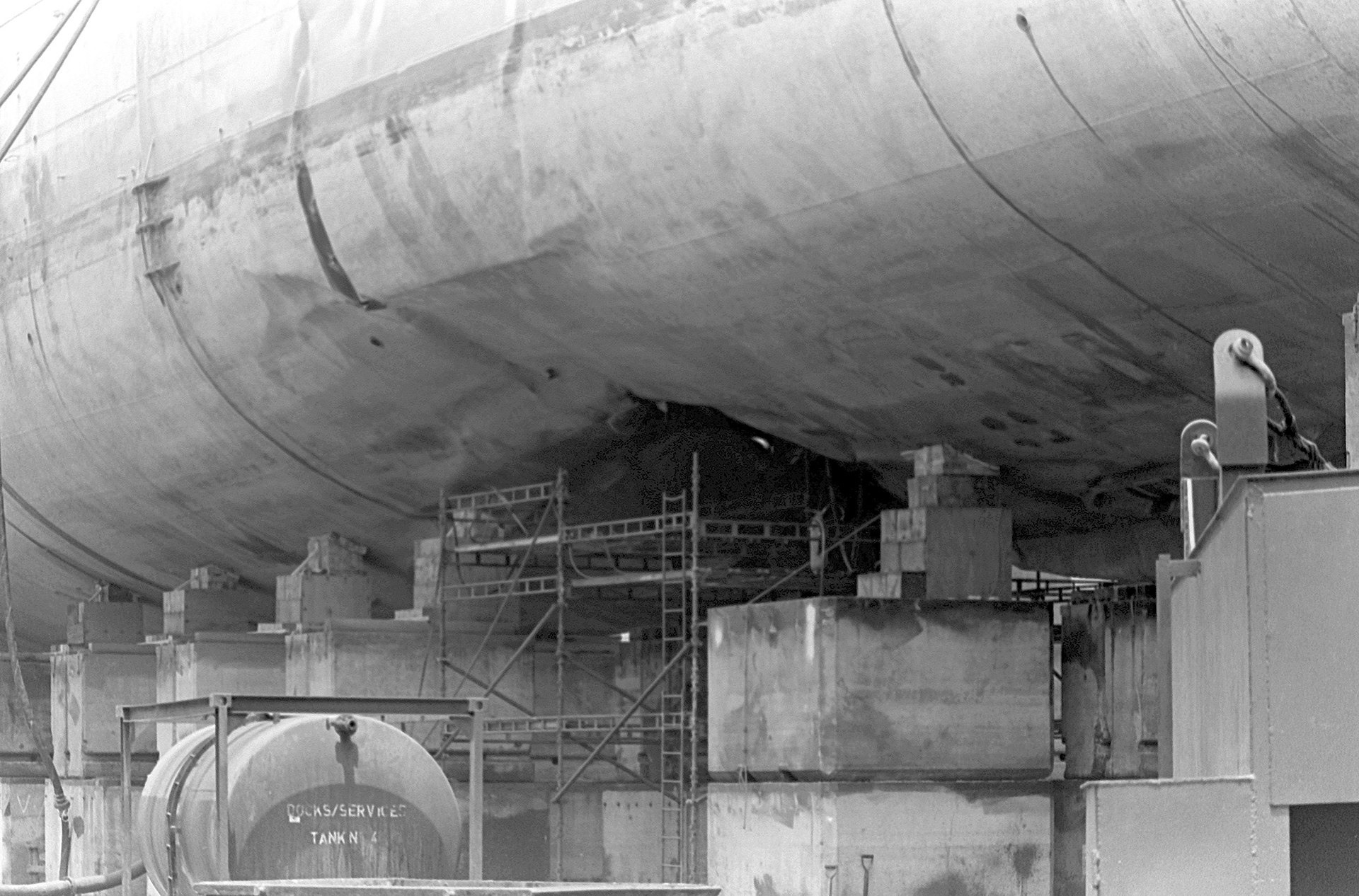 Hull damage to USS Samuel B. Roberts (FFG-58) in dry dock after striking an Iranian mine in the Persian Gulf, April 14 1988