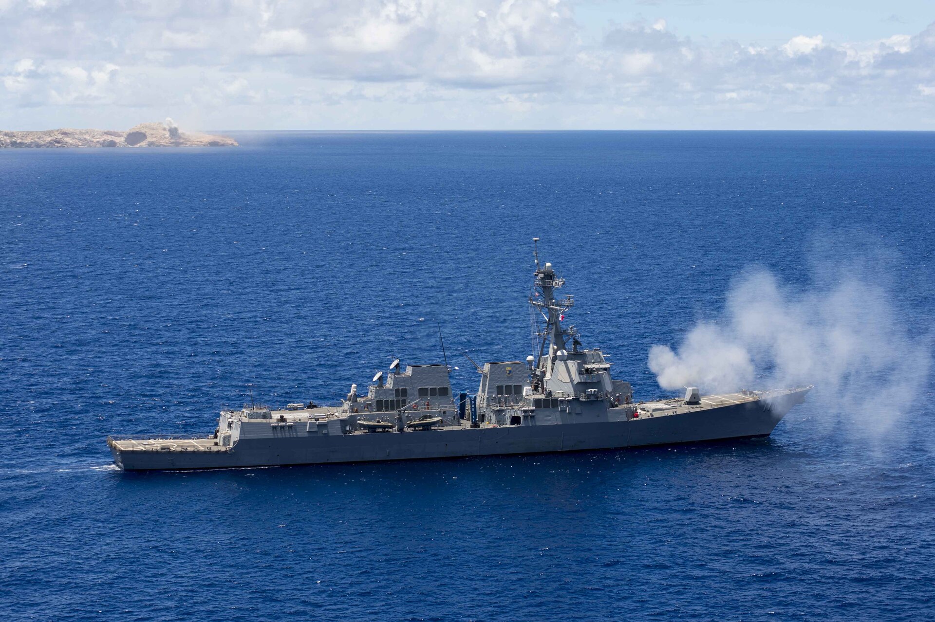 USS Spruance DDG-111 Arleigh Burke-class guided-missile destroyer fires its 5-inch gun during exercise