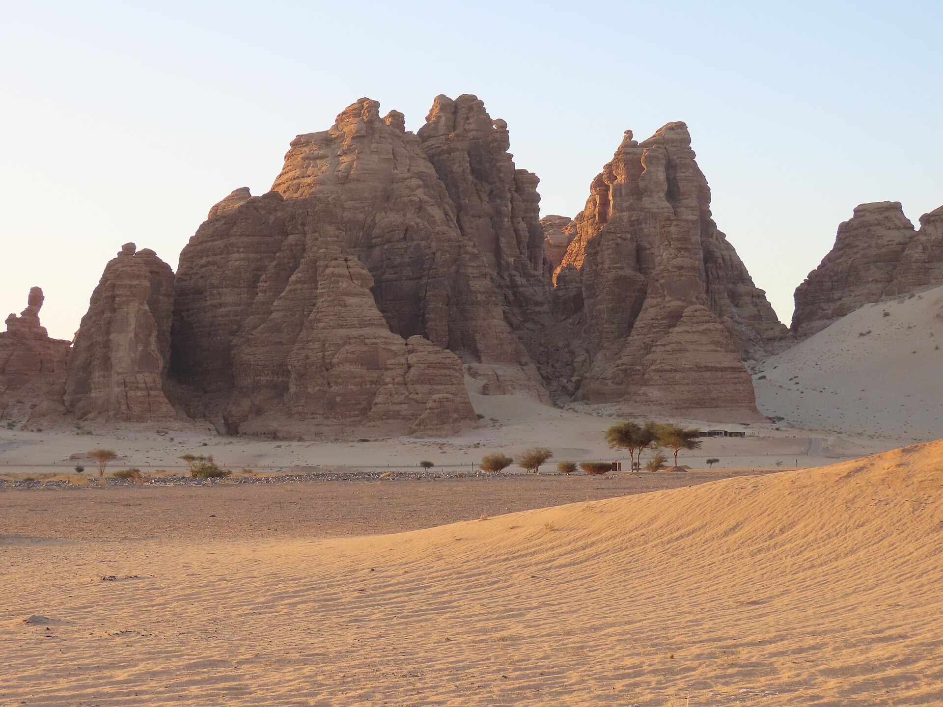 Sandstone rock formations in Wadi Ashar near AlUla, Saudi Arabia, showing the dramatic desert climbing terrain