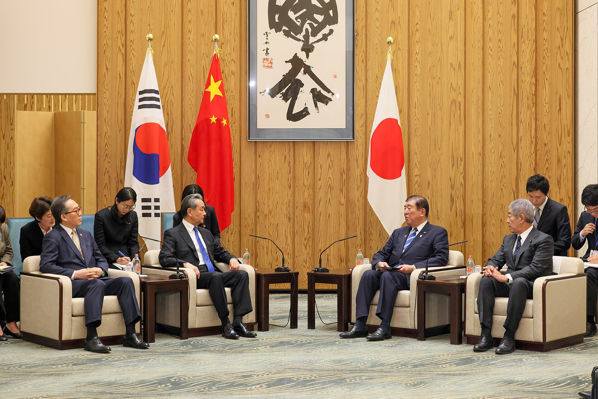 Chinese Foreign Minister Wang Yi meeting Japanese Prime Minister Ishiba in Tokyo, March 2025 — Wang Yi presented China's five-point Gulf peace initiative to Saudi FM Faisal bin Farhan in an April 2, 2026 phone call as Trump's Hormuz deadline approached