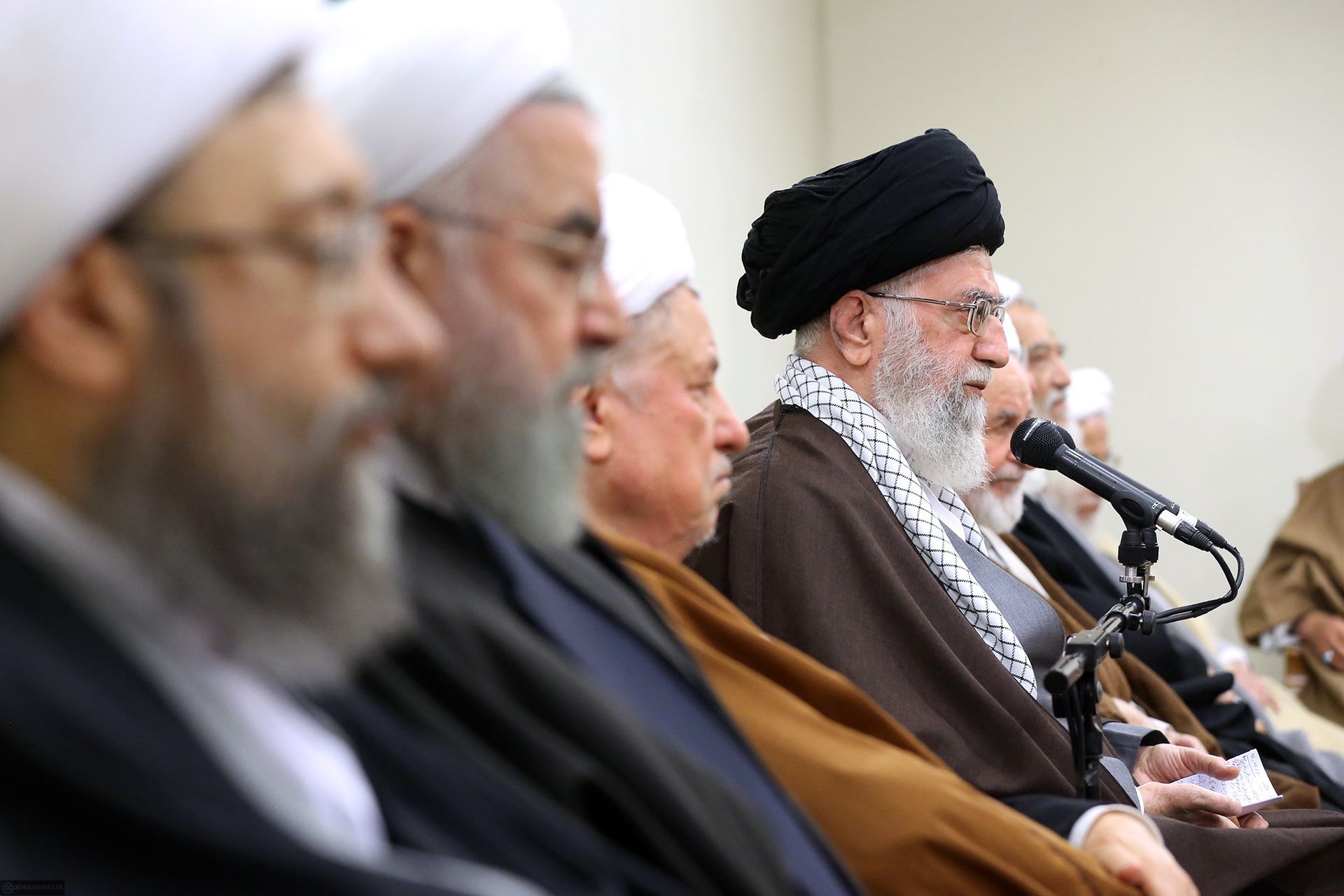Iran supreme leader Ali Khamenei addresses the Assembly of Experts — the constitutional body that selected his son Mojtaba as his successor in March 2026. The supreme leadership role Mojtaba now occupies operates through a military council of IRGC officers who control access and block reports from reaching him even from Iran's elected government. Photo: Khamenei.ir / CC BY 4.0